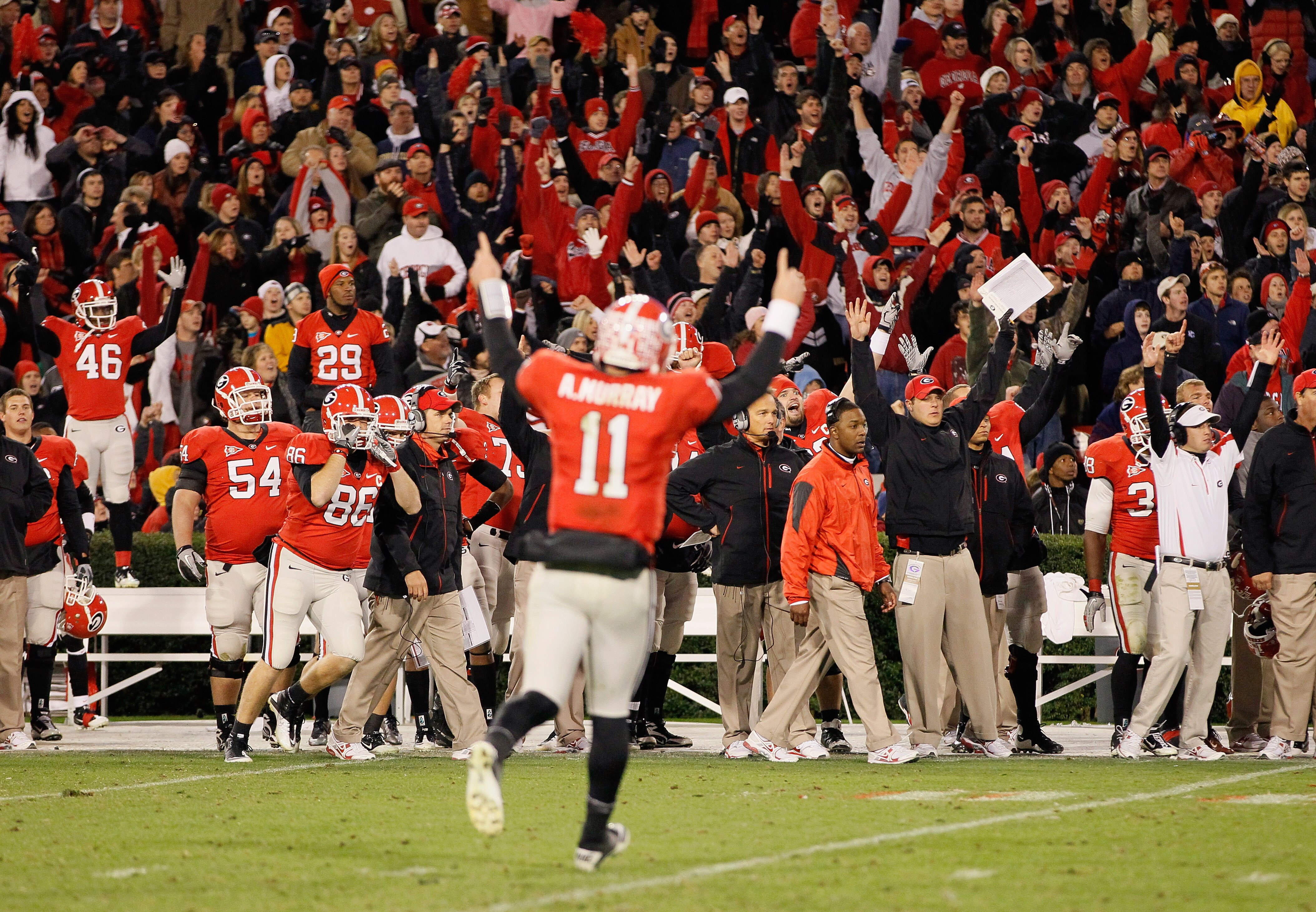 ATHENS, GA - NOVEMBER 27:  The Georgia Bulldogs and quarterback Aaron Murray #11 react after a touchdown in the final minutes of play against the Georgia Tech Yellow Jackets at Sanford Stadium on November 27, 2010 in Athens, Georgia.  (Photo by Kevin C. C