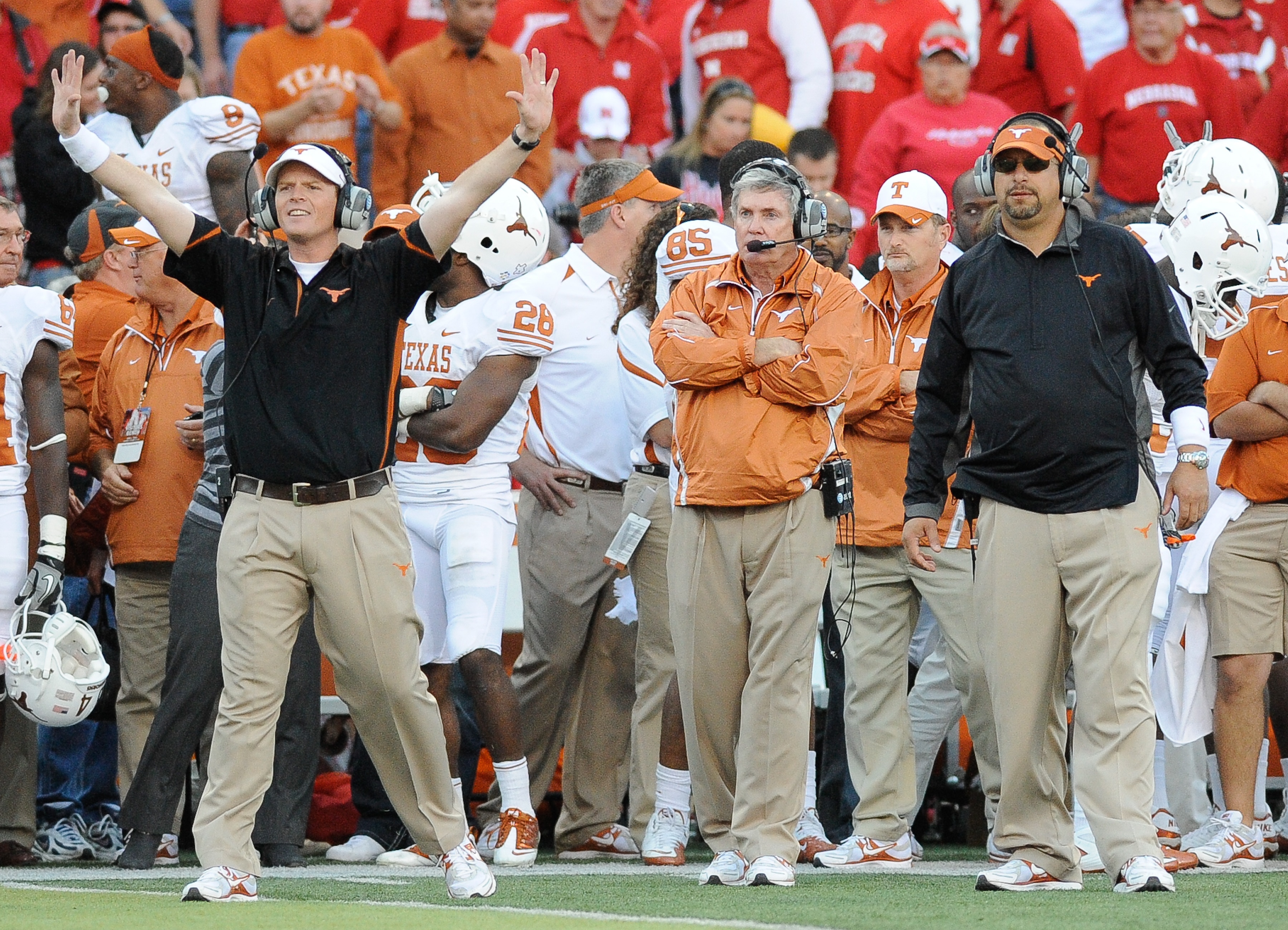 LINCOLN, NE - OCTOBER 16: Coach Mack Brown (center) of the Texas Longhorns watches as his team finishes off the Nebraska Cornuskers during second half action of their game at Memorial Stadium on October 16, 2010 in Lincoln, Nebraska. Texas Defeated Nebras