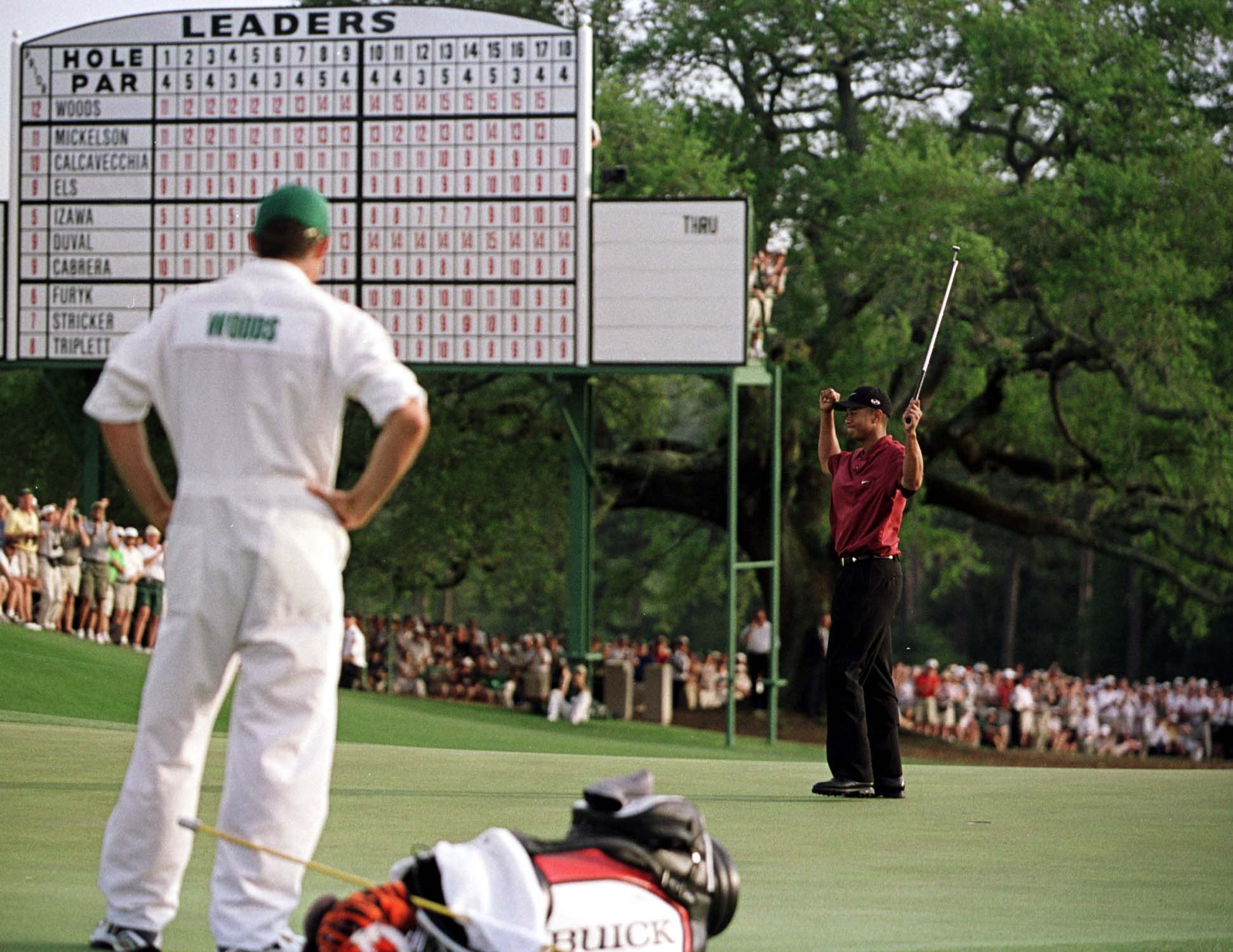 8 Apr 2001:  Tiger Woods of the USA celebrates with a birdie to win the Masters on the 18th green during the final day of the 2001 Masters at the Augusta National Golf Club, Augusta, GA, USA. Mandatory Credit: Stephen Munday/ALLSPORT