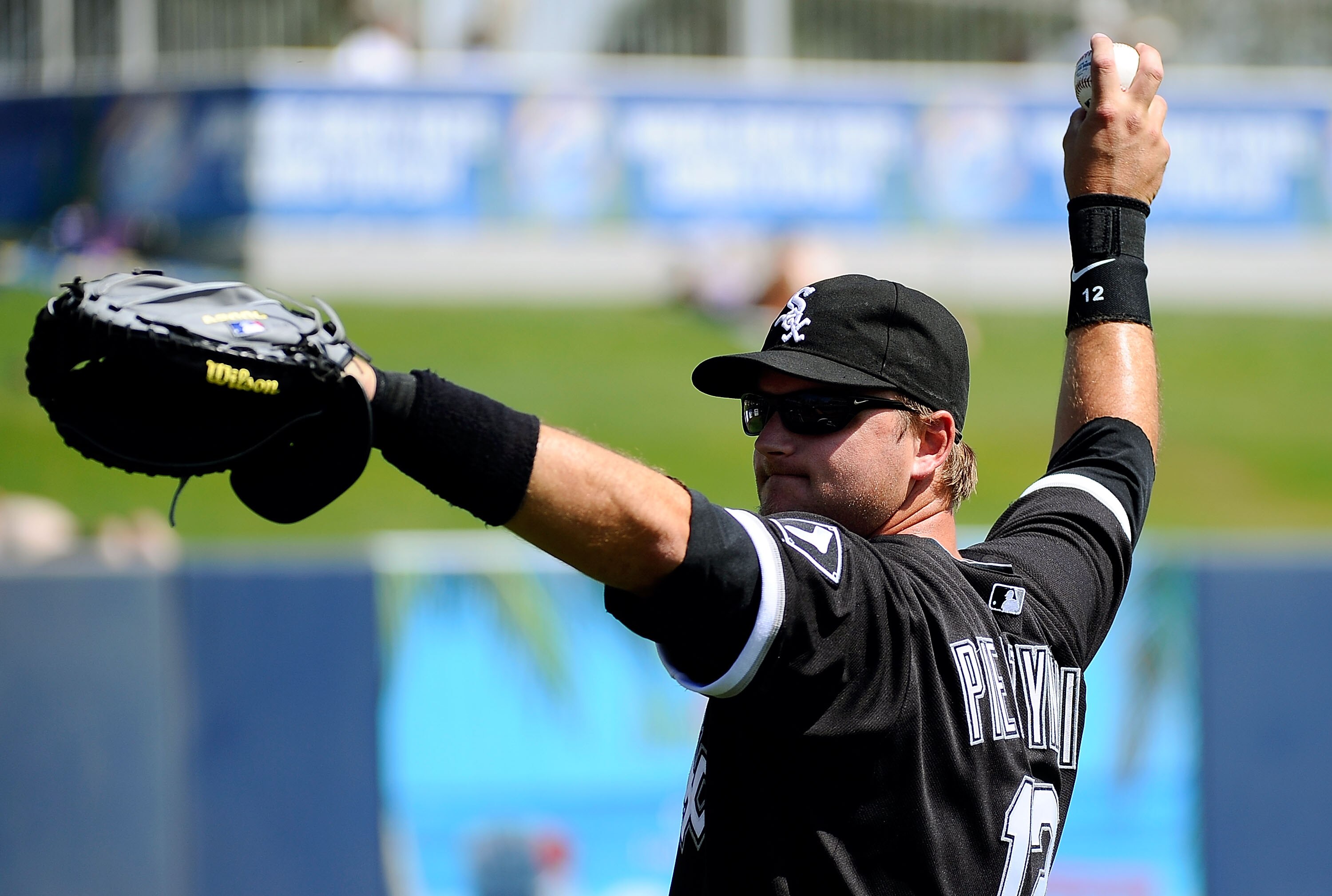 PHOENIX, AZ - MARCH 17:  A.J. Pierzynski #12 of the Chicago White Sox warms up on the field before playing against the Milwaukee Brewers during the spring training game at Maryvale Baseball Park on March 17, 2011 in Phoenix, Arizona.  (Photo by Kevork Dja