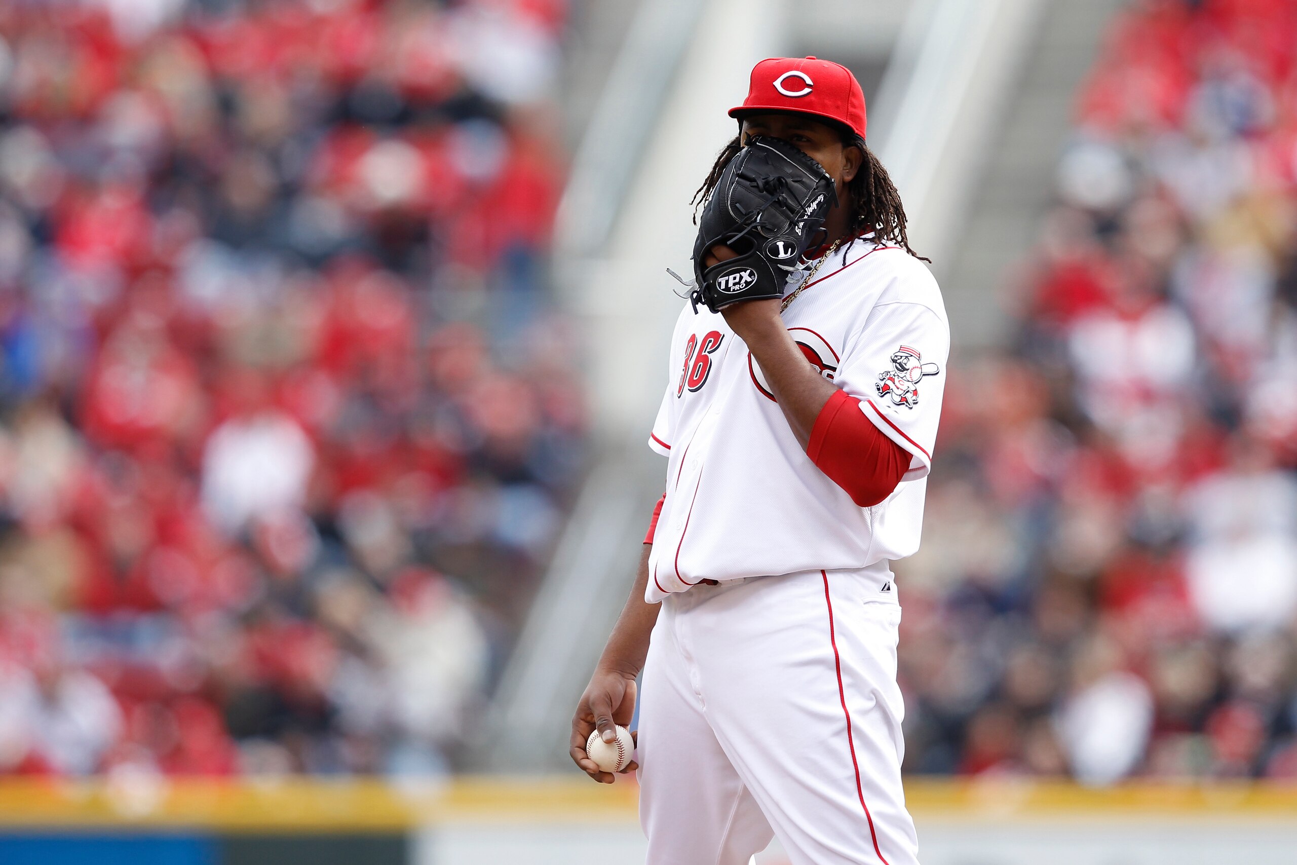 CINCINNATI, OH - MARCH 31: Edinson Volquez #36 of the Cincinnati Reds covers his face with his glove in between pitches during the opening day game at Great American Ballpark on March 31, 2011 in Cincinnati, Ohio. (Photo by Joe Robbins/Getty Images)