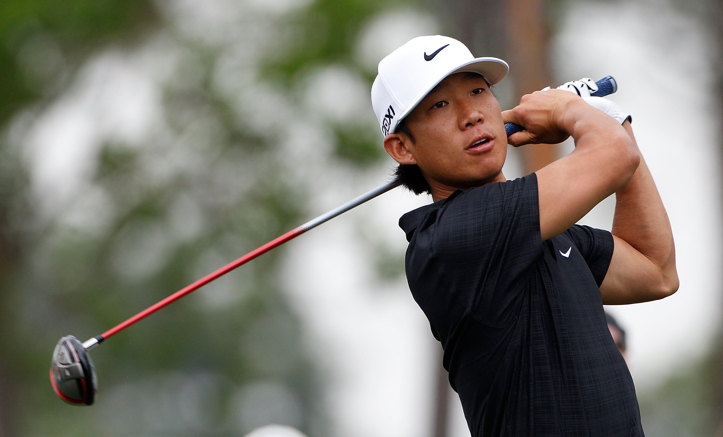 HUMBLE, TX - APRIL 03: Anthony Kim hits his drive on the fourth hole  during the final round of the Shell Houston Open at Redstone Golf Club on April 3, 2011 in Humble, Texas.  (Photo by Michael Cohen/Getty Images)