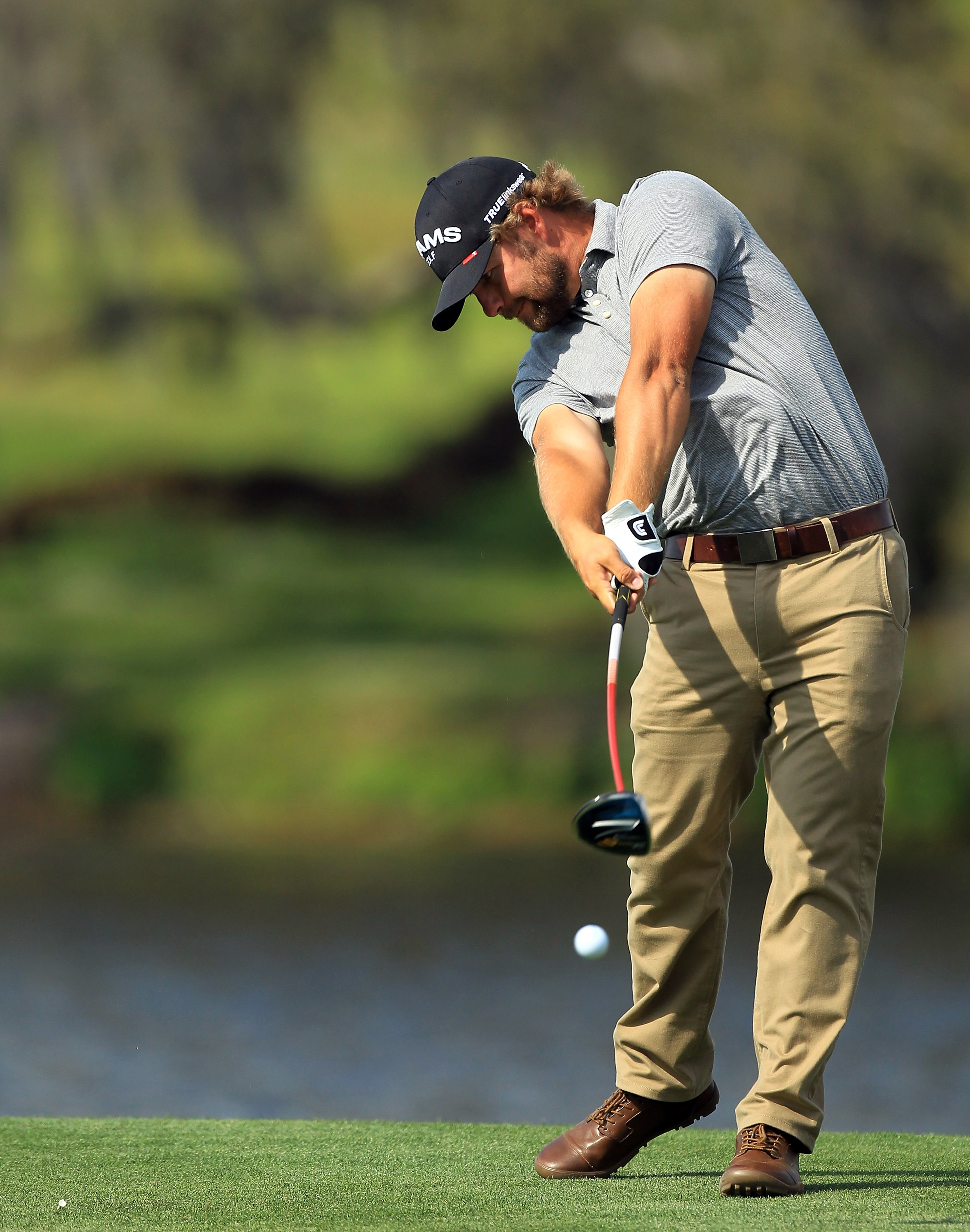 ORLANDO, FL - MARCH 27:  Ryan Moore of the USA plays his tee shot on the 16th hole during the final round of the 2011 Arnold Palmer Invitational presented by Mastercard at the Bay Hill Lodge and Country Club on March 27, 2011 in Orlando, Florida.  (Photo