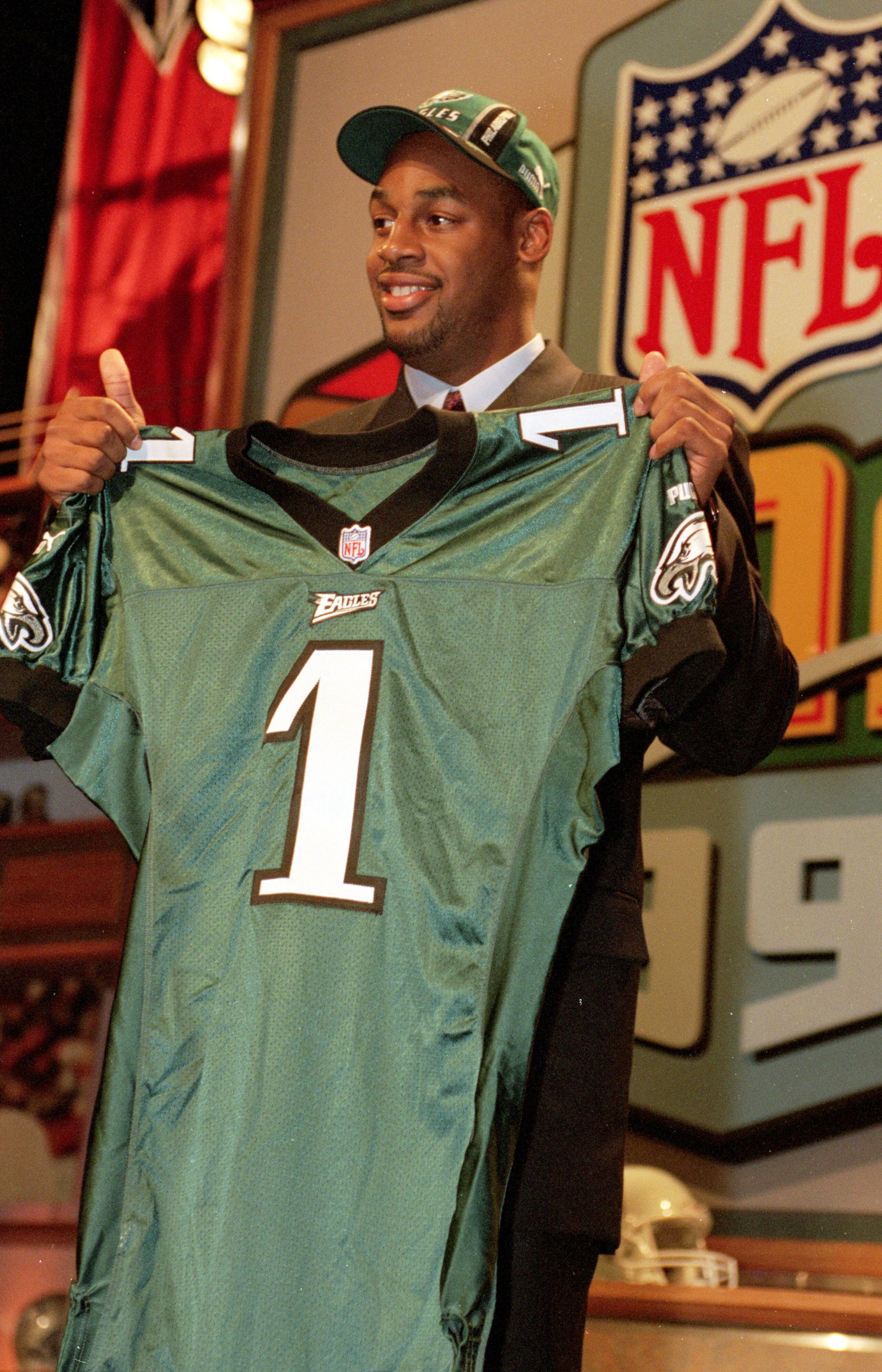 17 Apr 1999:  Donovan McNabb of the Philadelphia Eagles holds up his Eagles jersey during the NFL Draft at Madison Square Garden in New York, New York. Mandatory Credit: Ezra O. Shaw  /Allsport