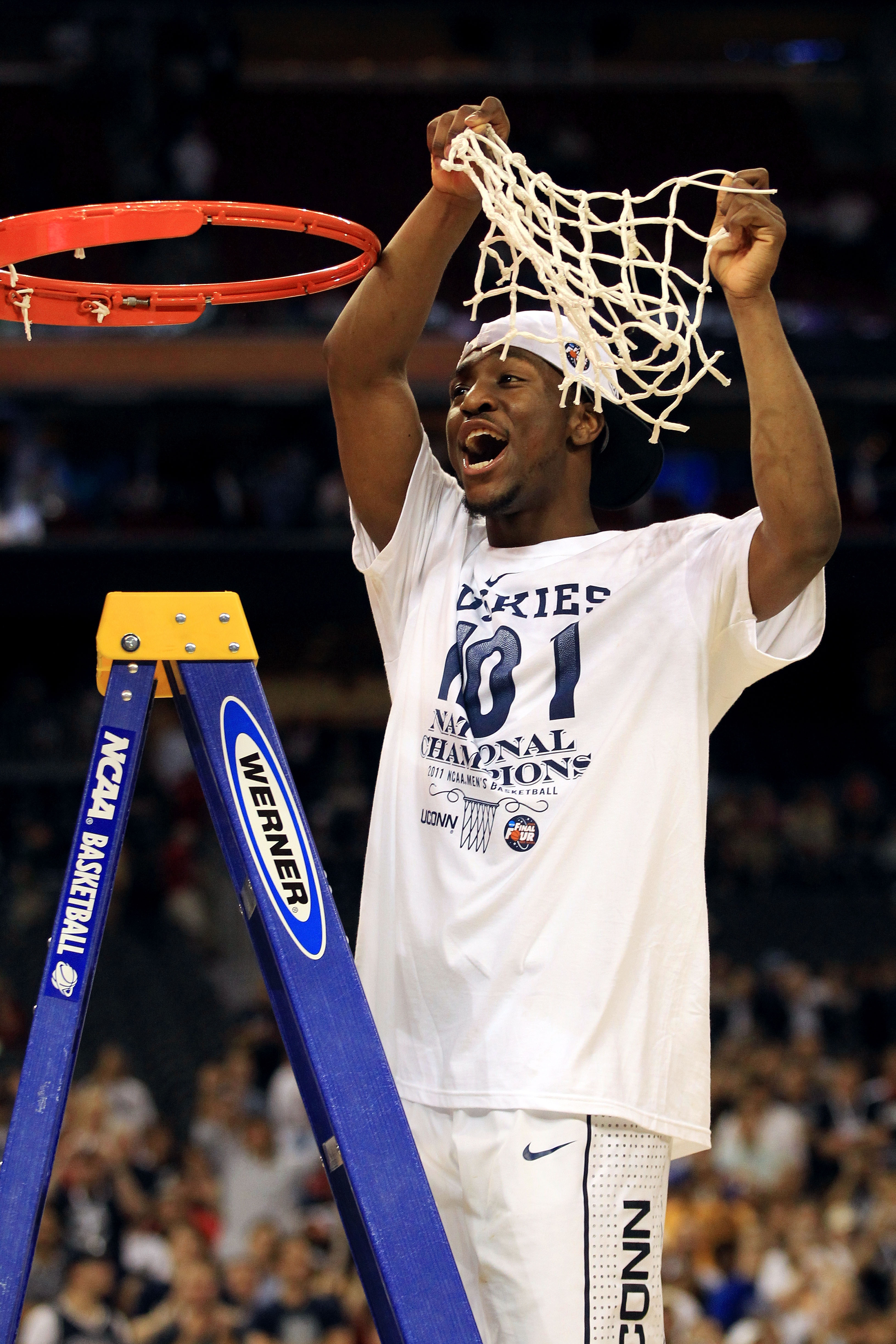 HOUSTON, TX - APRIL 04:  Kemba Walker #15 of the Connecticut Huskies cuts down the net after defeating the Butler Bulldogs to win the National Championship Game of the 2011 NCAA Division I Men's Basketball Tournament by a score of 53-41 at Reliant Stadium