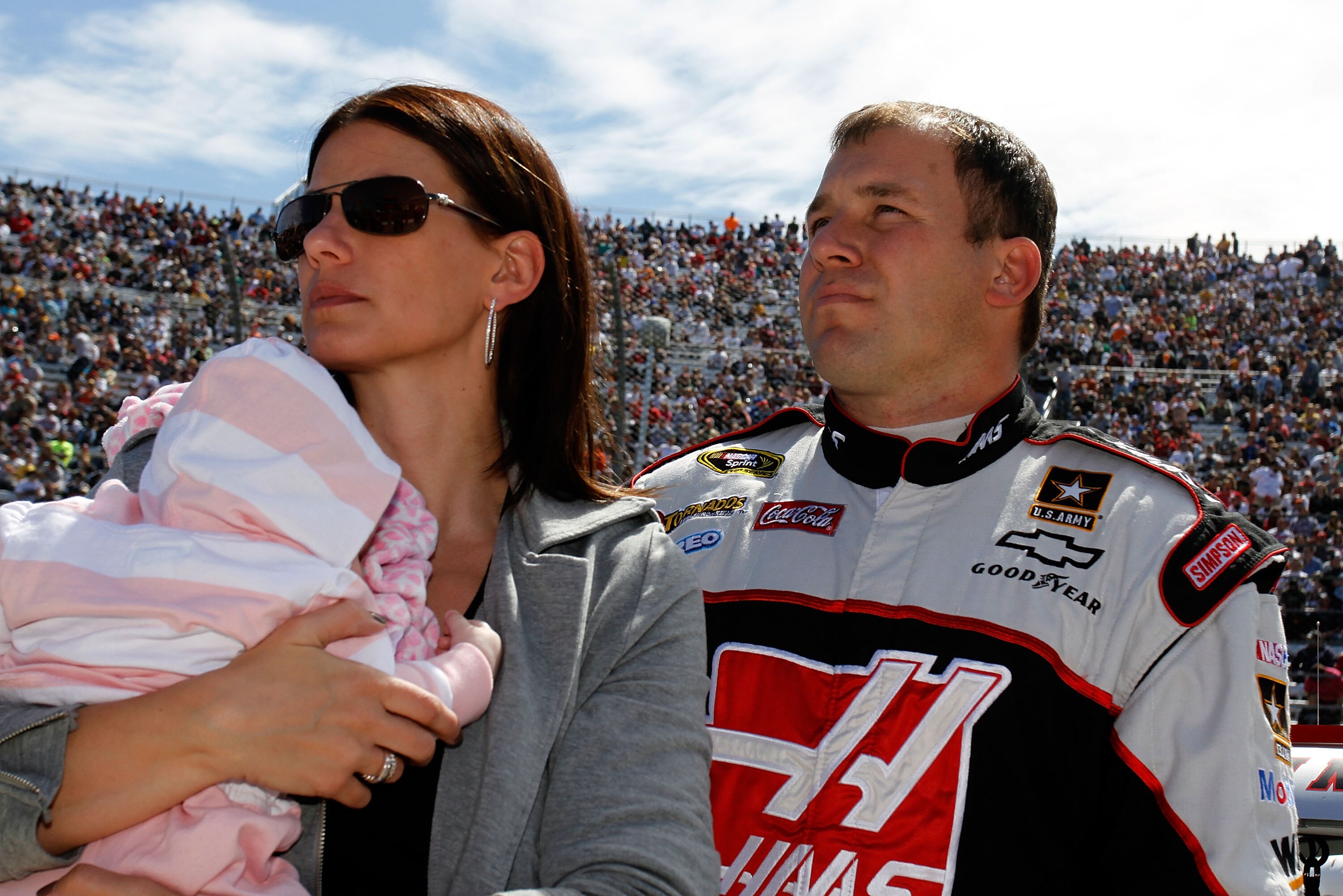 MARTINSVILLE, VA - APRIL 03:  Ryan Newman, driver of the #39 Haas Automation Chevrolet, stands with wife Krissie and their daughter Brooklyn Sage Newman on the grid prior to the start of the NASCAR Sprint Cup Series Goody's Fast Relief 500 at Martinsville