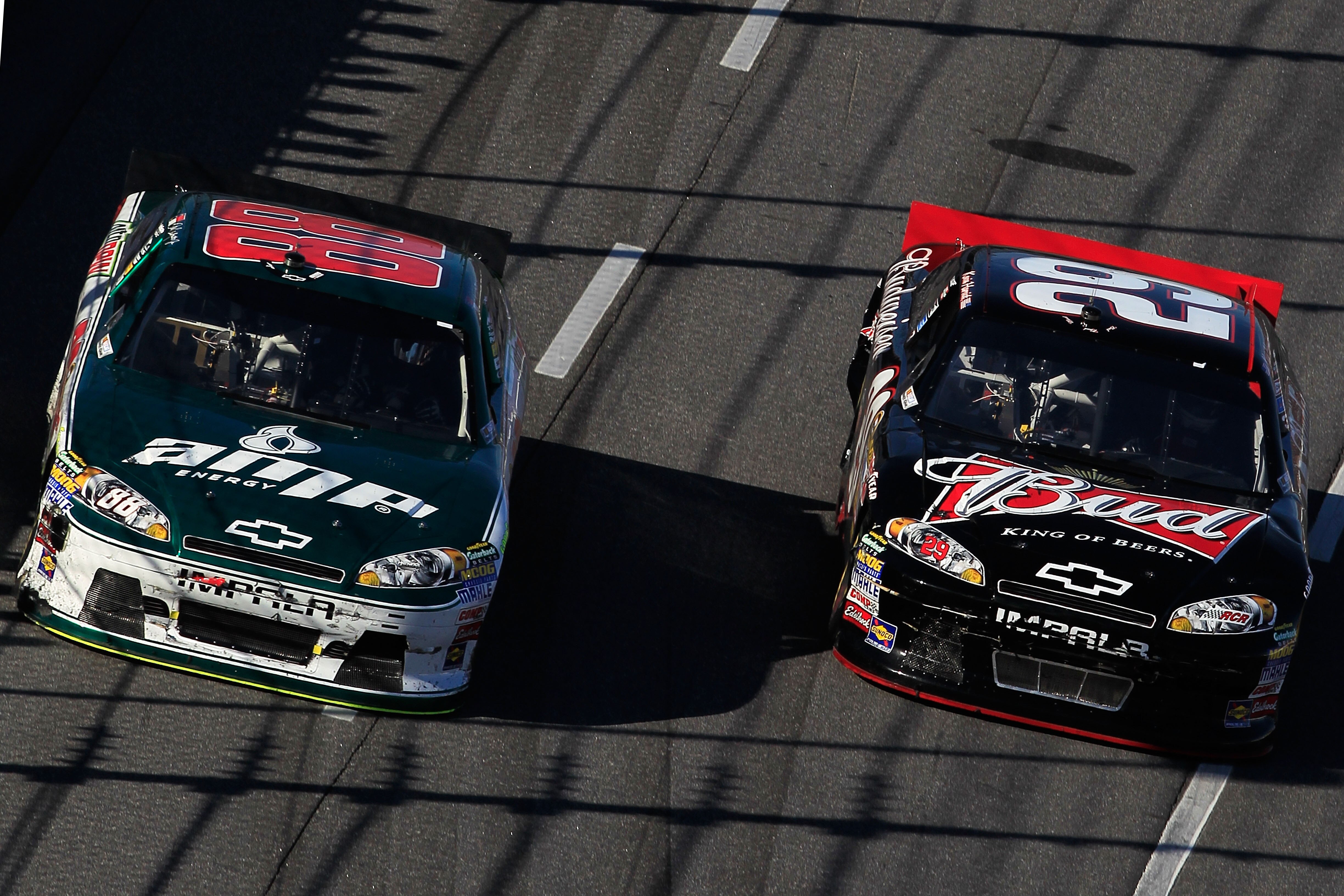 MARTINSVILLE, VA - APRIL 03:  Kevin Harvick, driver of the #29 Budweiser Chevrolet, race side by side Dale Earnhardt Jr., driver of the #88 Amp Energy/National Guard Chevrolet, during the NASCAR Sprint Cup Series Goody's Fast Relief 500 at Martinsville Sp