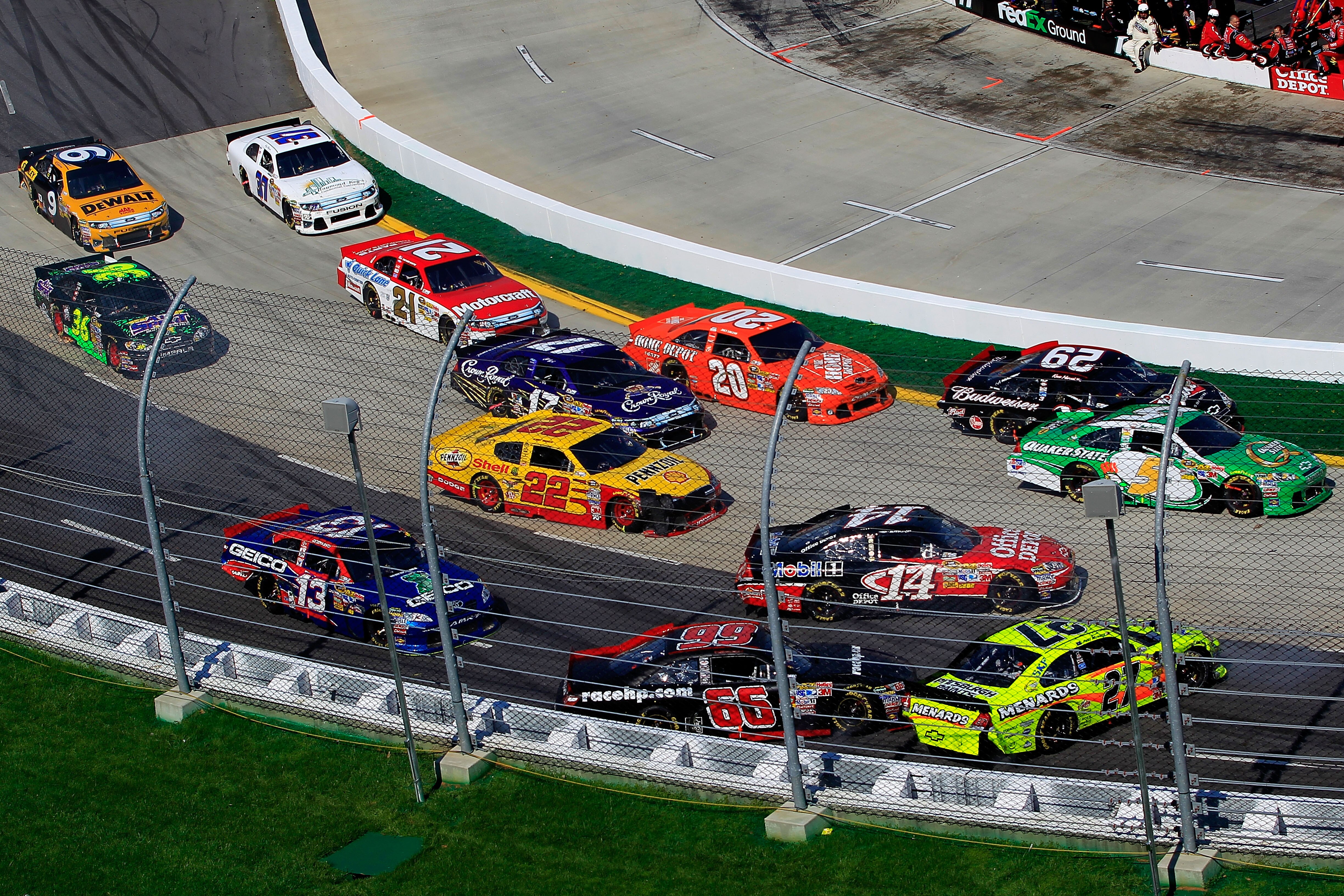 MARTINSVILLE, VA - APRIL 03:  Paul Menard, driver of the #27 NIBCO/Menards Chevrolet, spins out after cutting a tire during the NASCAR Sprint Cup Series Goody's Fast Relief 500 at Martinsville Speedway on April 3, 2011 in Martinsville, Virginia.  (Photo b