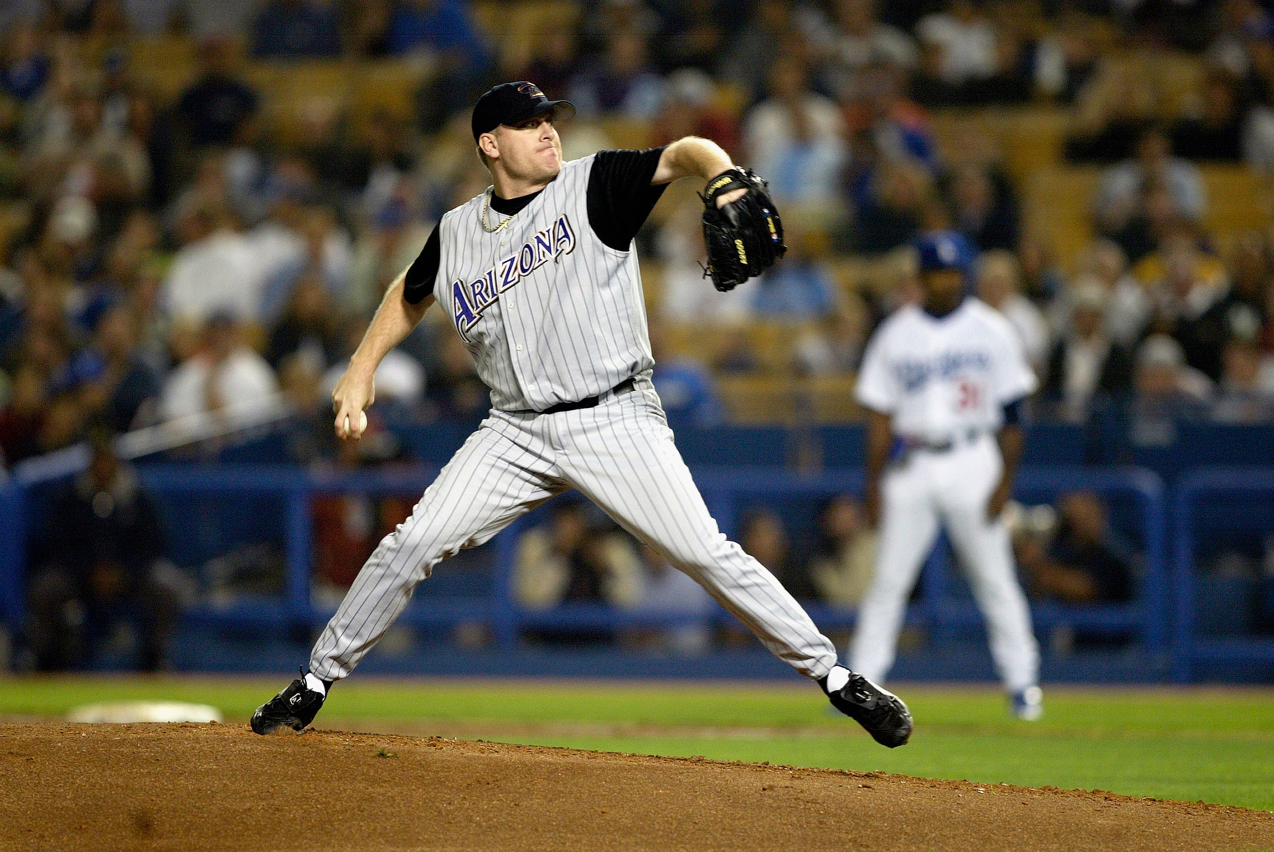 LOS ANGELES - SEPTEMBER 16:  Curt Schilling #38 of the Arizona Diamondbacks throws against the Los Angeles Dodgers during the game on September 16, 2003 at Dodger Stadium in Los Angeles, California.  The Diamondbacks defeated the Dodgers 3-2.  (Photo by J