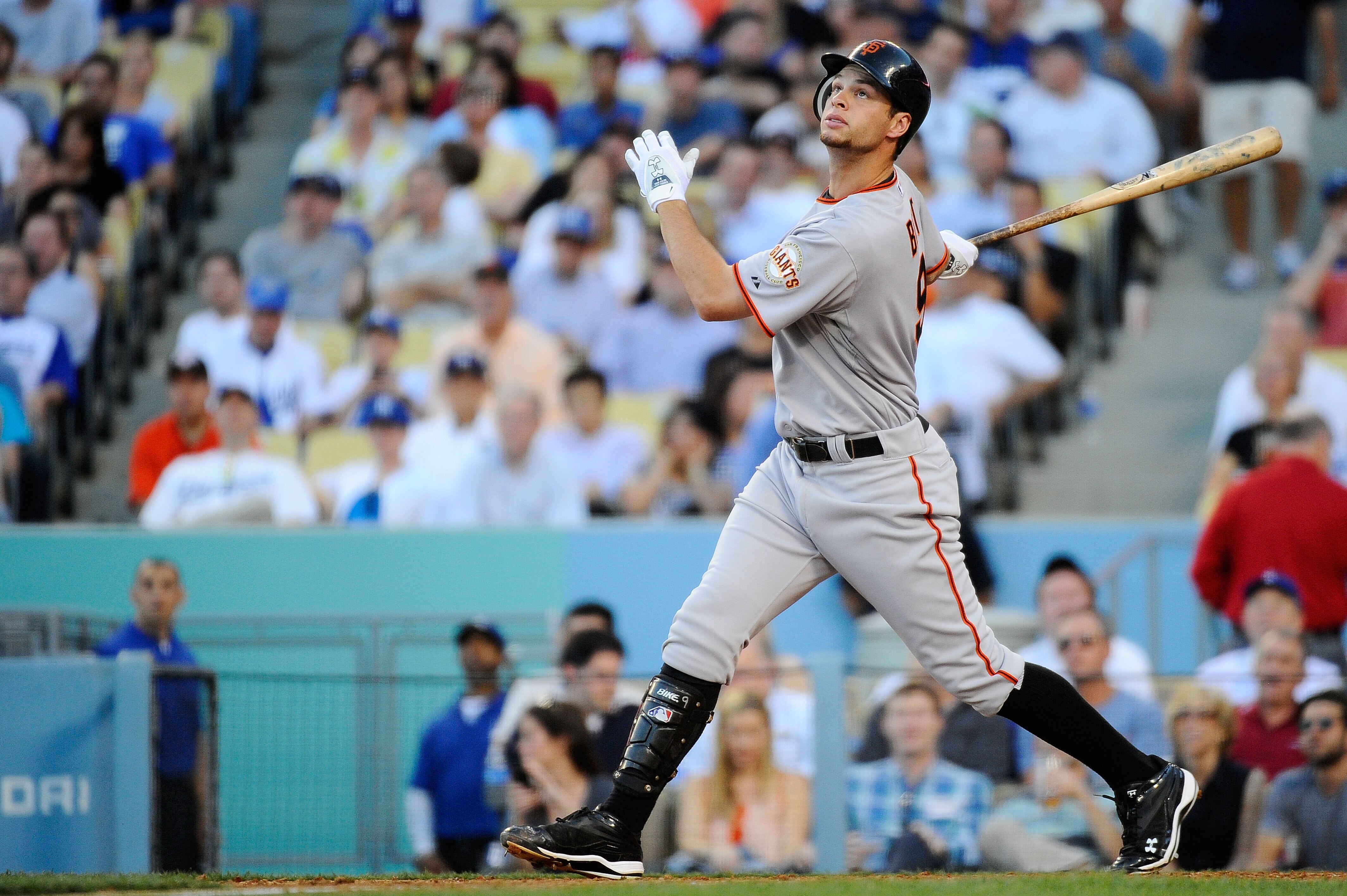 LOS ANGELES, CA - MARCH 31:  Brandon Belt #9 of the San Francisco Giants swings during an at bat against the Los Angeles Dodgers on Opening Day at Dodger Stadium on March 31, 2011 in Los Angeles, California.  (Photo by Kevork Djansezian/Getty Images)