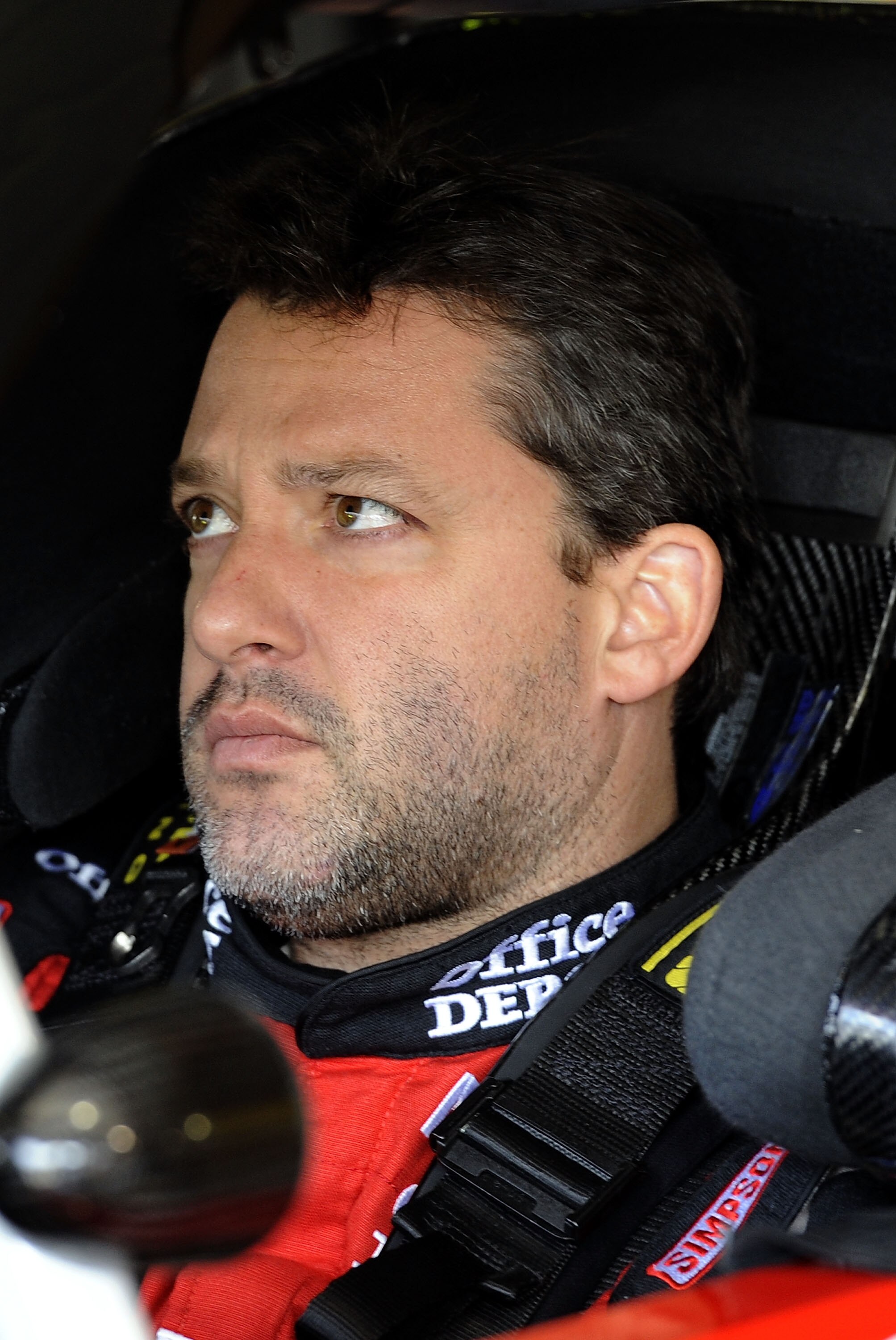 MARTINSVILLE, VA - APRIL 01:  Tony Stewart, driver of the #14 Office Depot/Mobil 1 Chevrolet, sits in his car during practice for the NASCAR Sprint Cup Series Goody's Fast Relief 500 at Martinsville Speedway on April 1, 2011 in Martinsville, Virginia.  (P