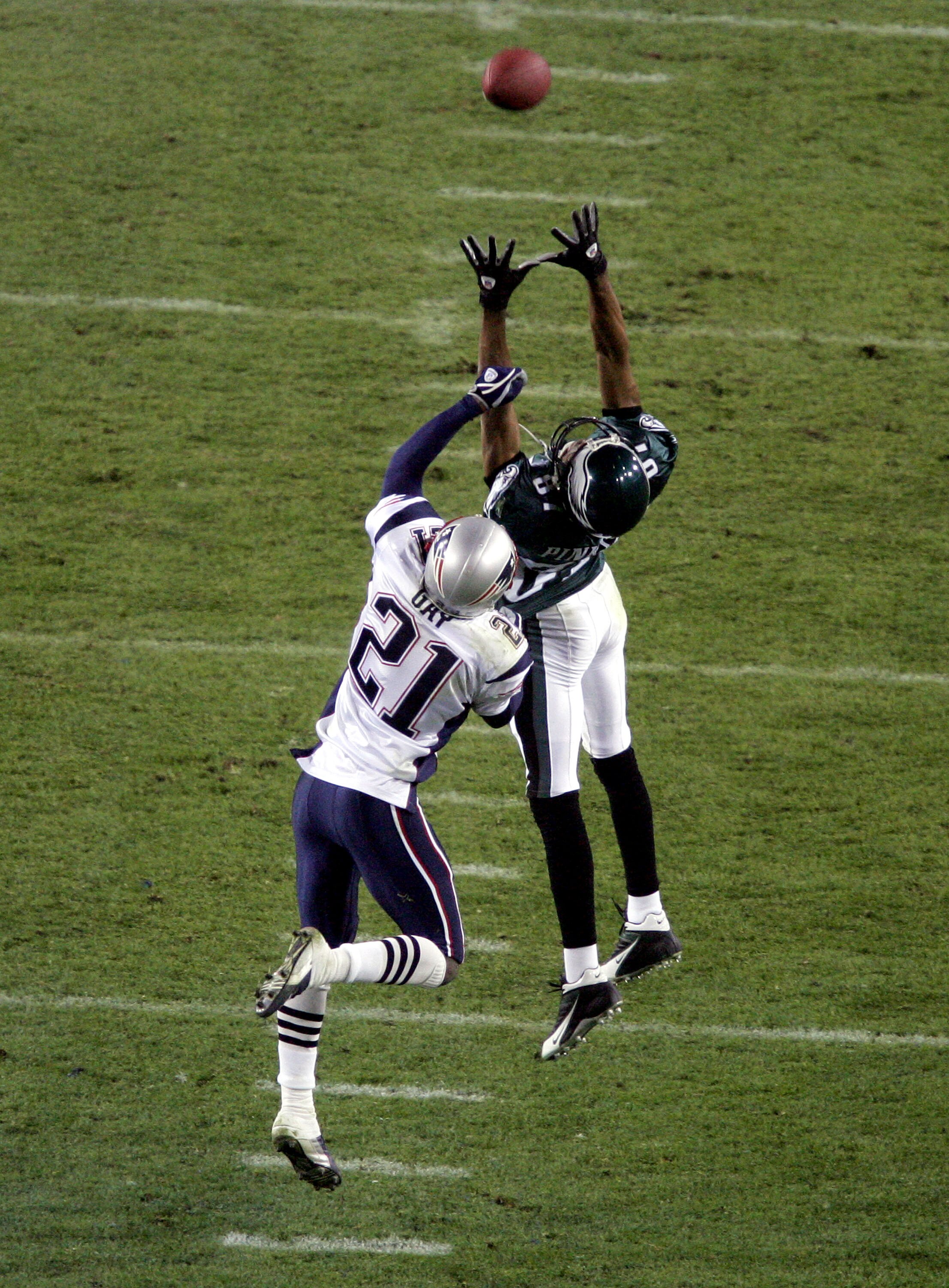 JACKSONVILLE, FL - FEBRUARY 6:  Wide receiver Todd Pinkston #87 of the Philadelphia Eagles goes up for a catch in front of Randall Gay #21 of the New England Patriots during Super Bowl XXXIX at Alltel Stadium on February 6, 2005 in Jacksonville, Florida.