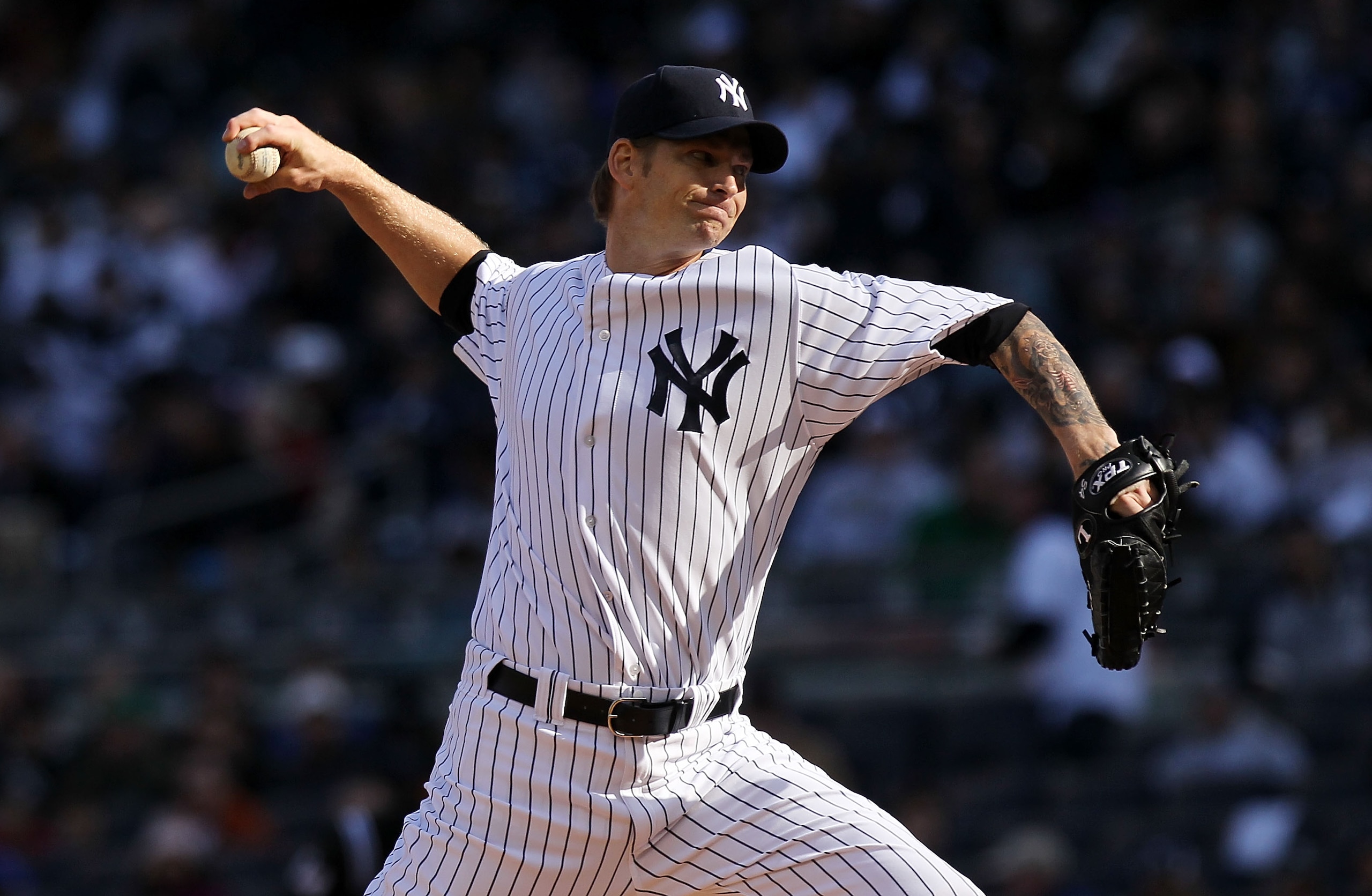 NEW YORK, NY - APRIL 02: A.J. Burnett #34 of the New York Yankees pitches against the Detroit Tigers at Yankee Stadium on April 2, 2011 in the Bronx borough of New York City.  (Photo by Nick Laham/Getty Images)