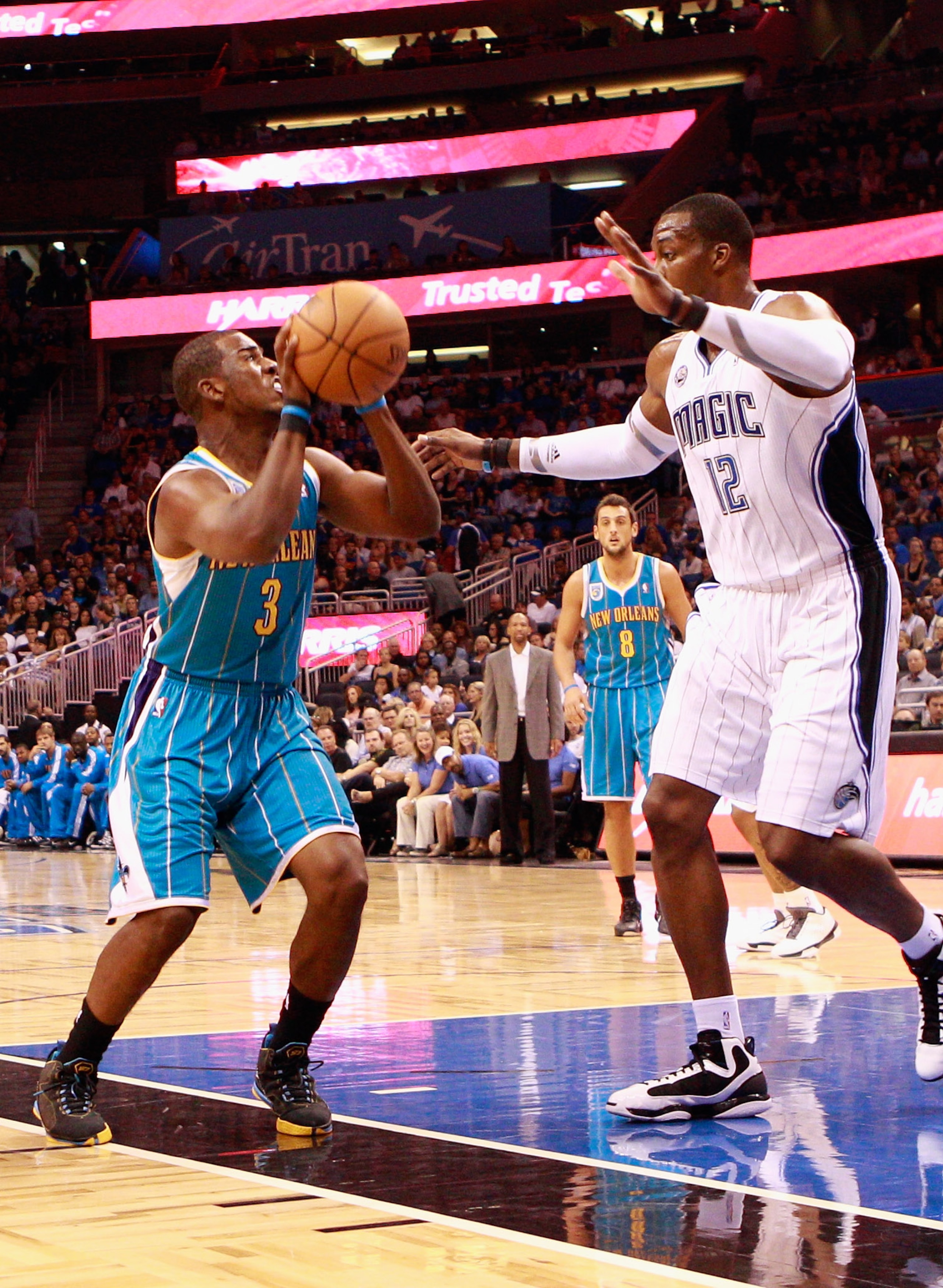 ORLANDO, FL - OCTOBER 10: Chris Paul #3 of the New Orleans Hornets attempts a shot against Dwight Howard #12 of the Orlando Magic during the game at Amway Arena on October 10, 2010 in Orlando, Florida. NOTE TO USER: User expressly acknowledges and agrees ORLANDO, FL - OCTOBER 10: Chris Paul #3 of the New Orleans Hornets attempts a shot against Dwight Howard #12 of the Orlando Magic during the game at Amway Arena on October 10, 2010 in Orlando, Florida. NOTE TO USER: User expressly acknowledges and agrees