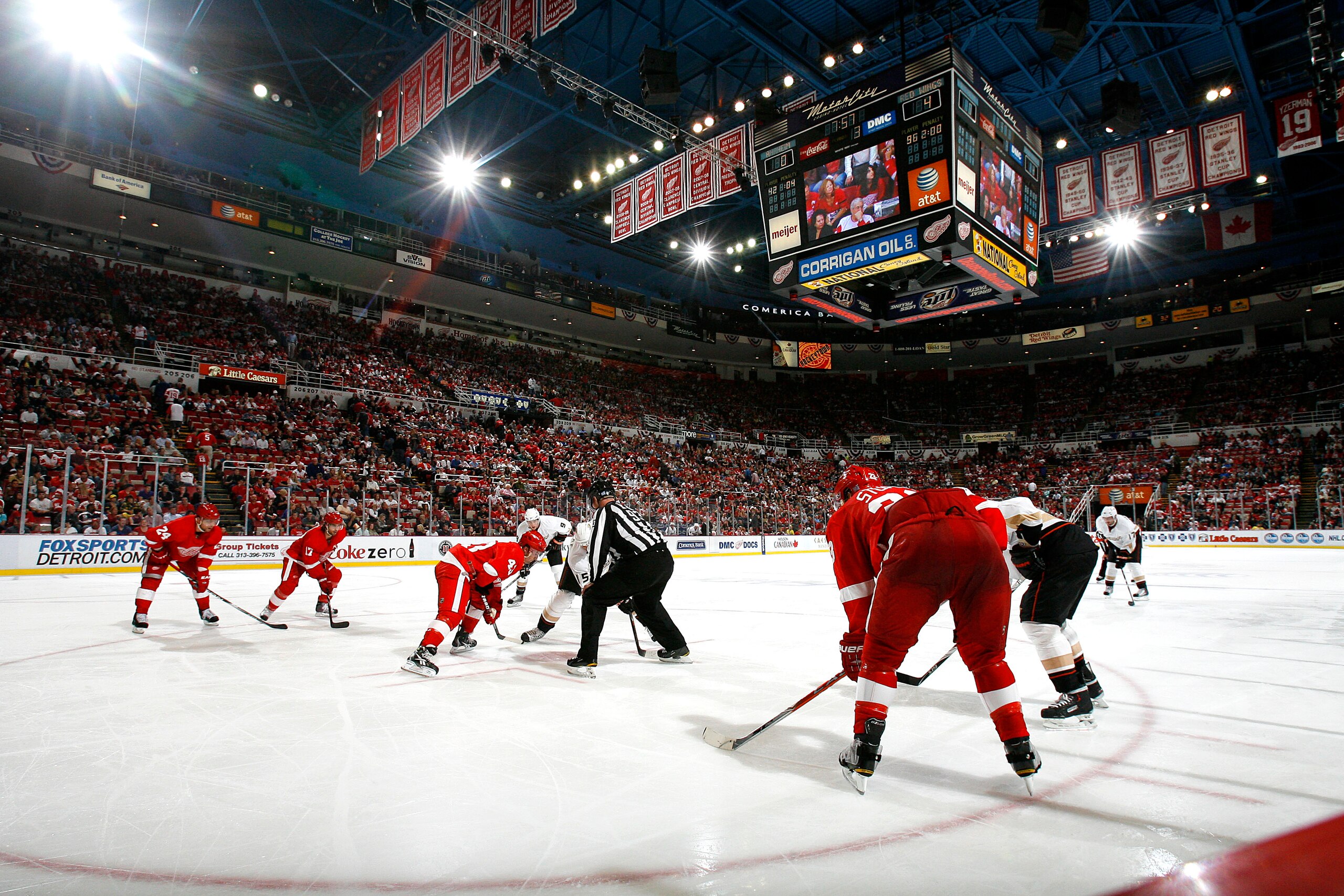 DETROIT - OCTOBER 08:  Members of the Anaheim Ducks line up for a face-off against members of the Detroit Red Wings during their NHL game at Joe Louis Arena on October 8, 2010 in Detroit, Michigan.(Photo by Dave Sandford/Getty Images)