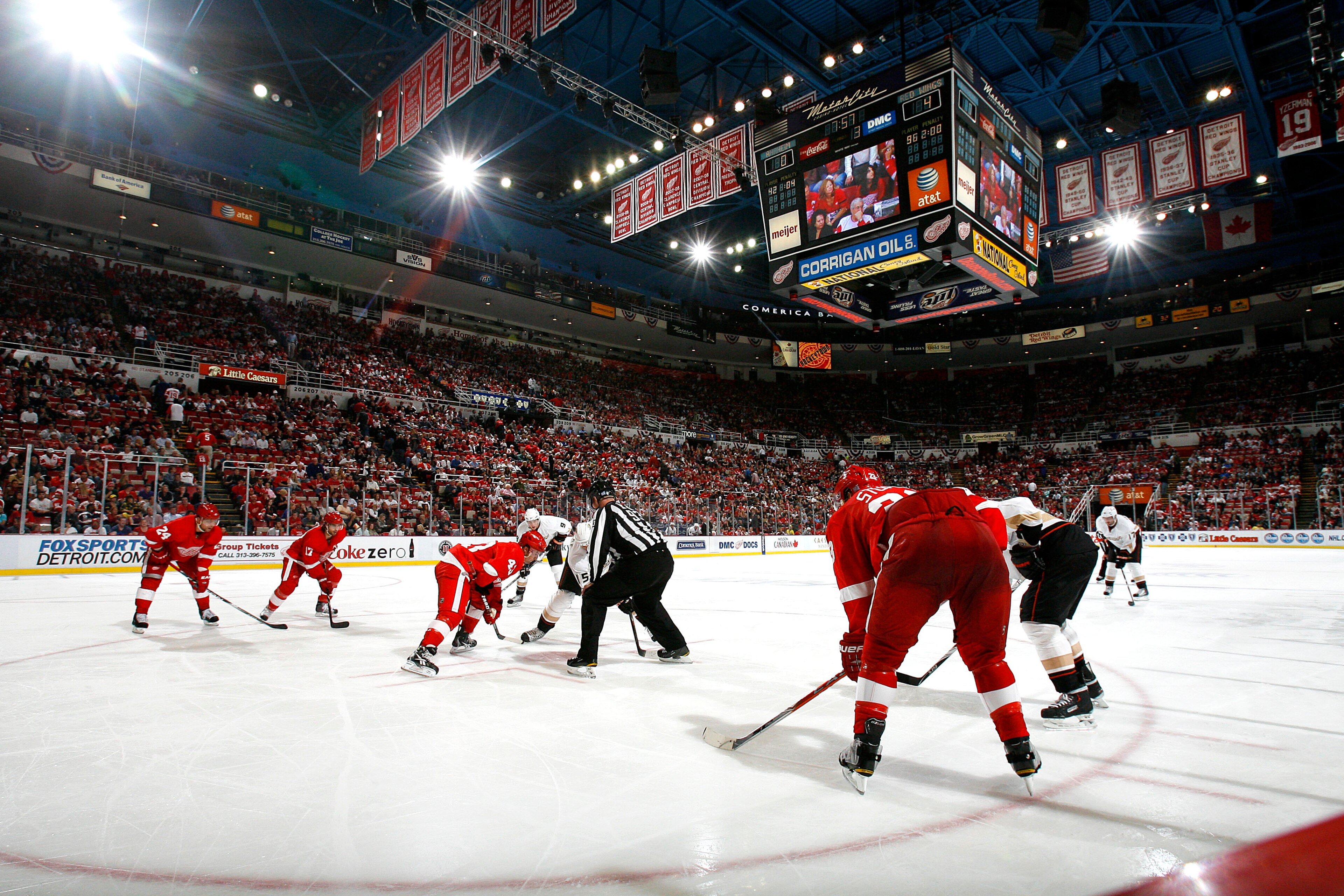 DETROIT - OCTOBER 08:  Members of the Anaheim Ducks line up for a face-off against members of the Detroit Red Wings during their NHL game at Joe Louis Arena on October 8, 2010 in Detroit, Michigan.(Photo by Dave Sandford/Getty Images)