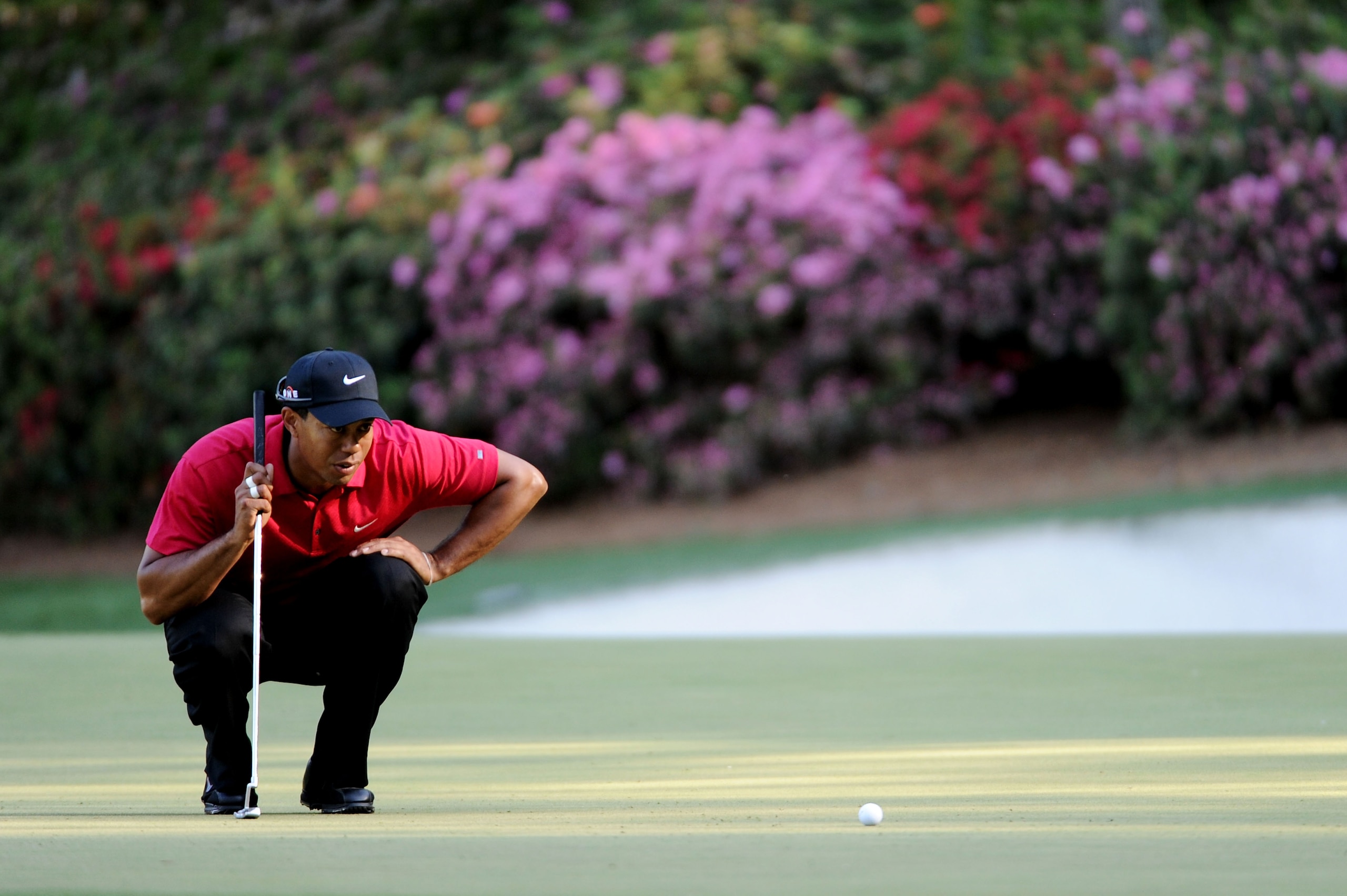AUGUSTA, GA - APRIL 11: Tiger Woods lines up a putt on the 13th green during the final round of the 2010 Masters Tournament at Augusta National Golf Club on April 11, 2010 in Augusta, Georgia. (Photo by Harry How/Getty Images) AUGUSTA, GA - APRIL 11: Tiger Woods lines up a putt on the 13th green during the final round of the 2010 Masters Tournament at Augusta National Golf Club on April 11, 2010 in Augusta, Georgia. (Photo by Harry How/Getty Images)