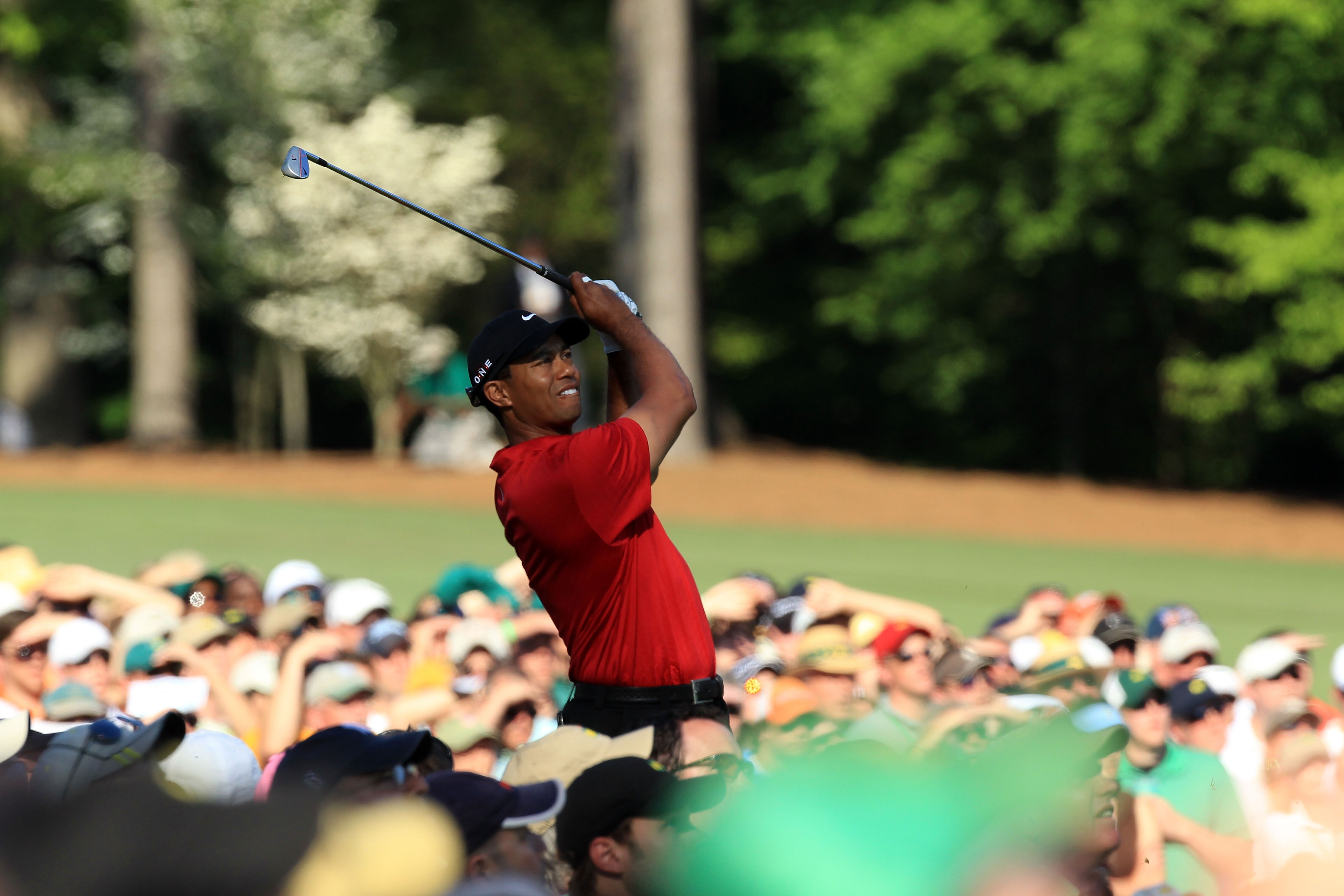 AUGUSTA, GA - APRIL 11:  Tiger Woods watches his tee shot on the 12th hole during the final round of the 2010 Masters Tournament at Augusta National Golf Club on April 11, 2010 in Augusta, Georgia.  (Photo by David Cannon/Getty Images)