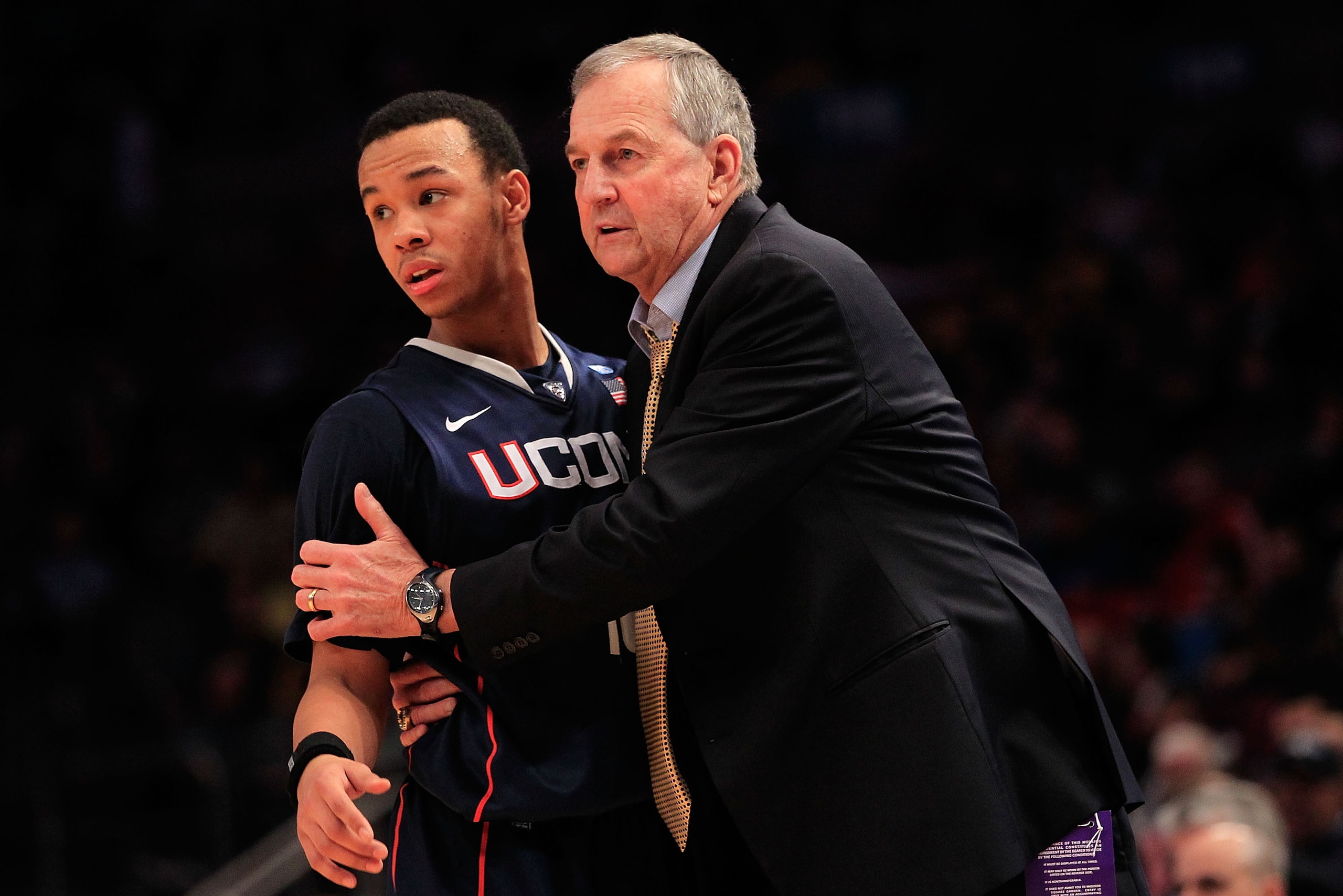 NEW YORK, NY - MARCH 09: Shabazz Napier #13 of the Connecticut Huskies is held by his coach Jim Calhoun during the game against the Gerogetown Hoyas during the second round of the 2011 Big East Men's Basketball Tournament presented by American Eagle Outfi