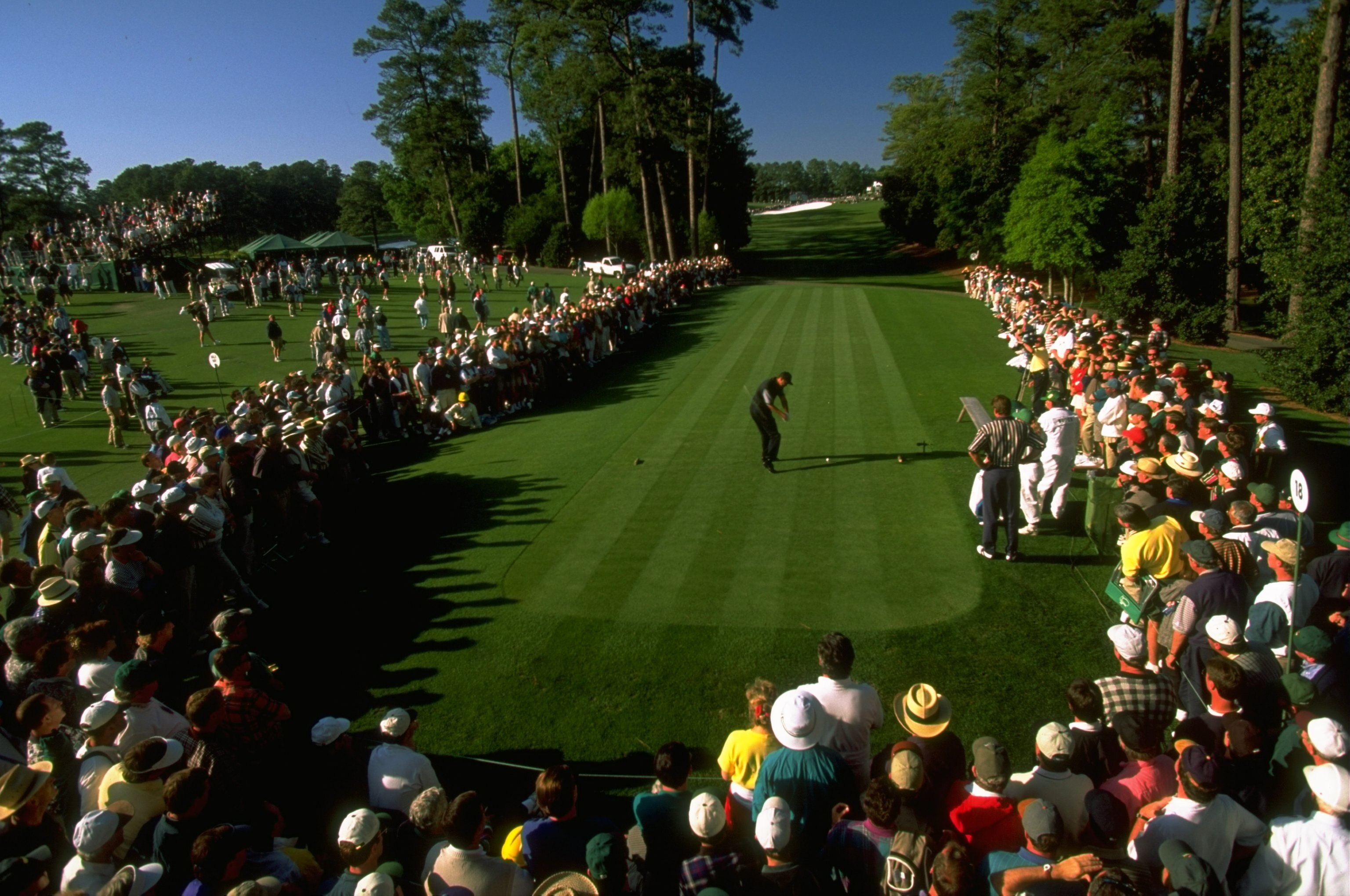 10 Apr 1997: Tiger Woods of the USA tees off at the 18th during the first day of the US Masters at Augusta, Georgia. Woods went on to win the tournament with a record low score of 270, eighteen under par. \ Mandatory Credit: Stephen Munday /Allsport