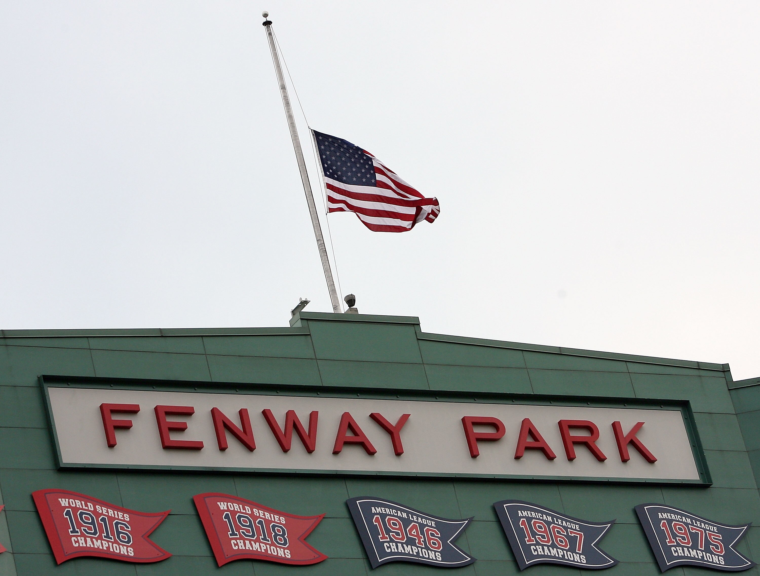 BOSTON - AUGUST 26:  The U.S. flag flies at half staff in honor of the late U.S. Sen. Ted Kennedy (D-MA) before the Boston Red Sox take on the Chicago White Sox on August 26, 2009 at Fenway Park in Boston, Massachusetts.  (Photo by Elsa/Getty Images)