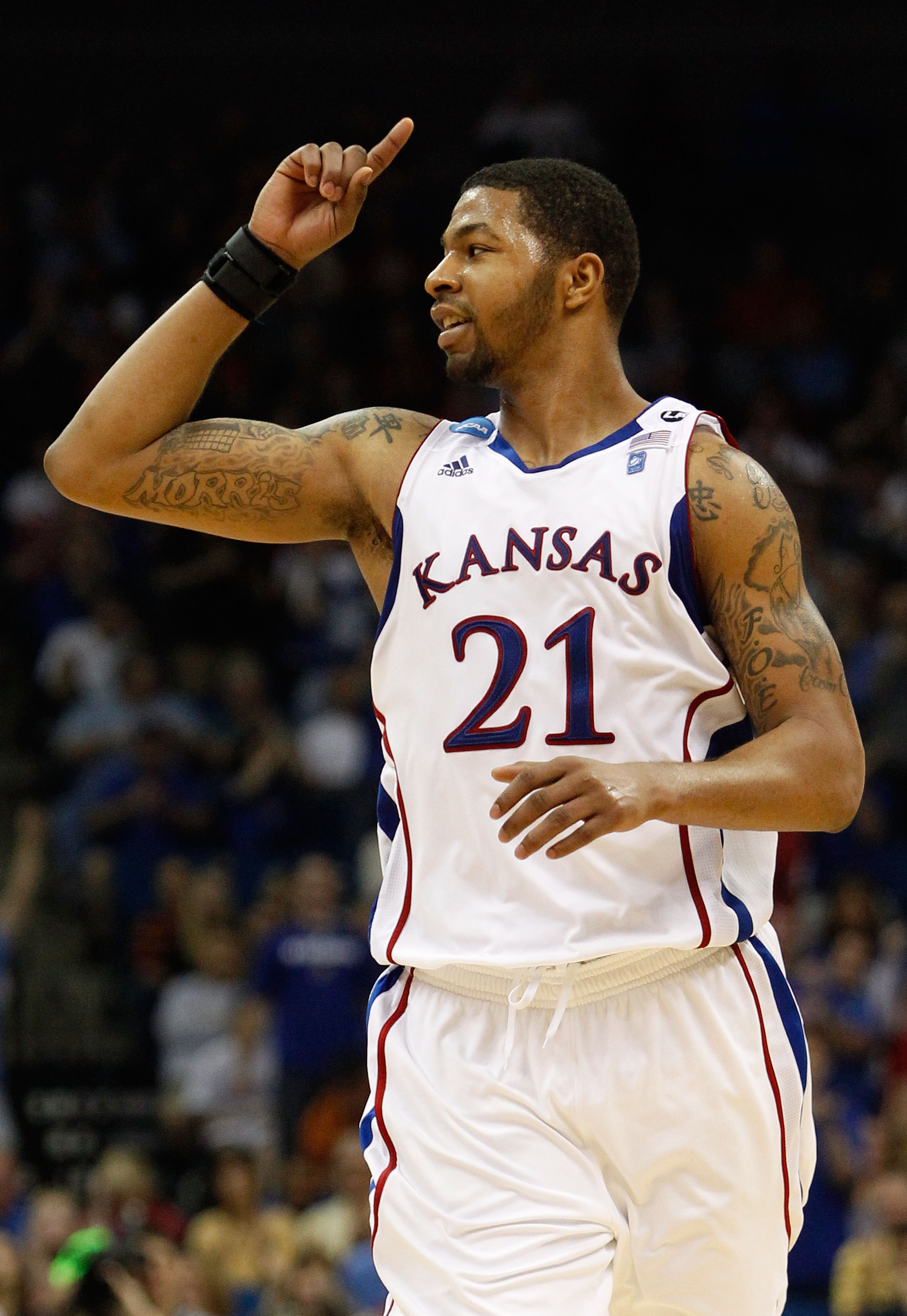 TULSA, OK - MARCH 20:  Markieff Morris #21 of the Kansas Jayhawks celebrates after a play against the Illinois Fighting Illini during the third round of the 2011 NCAA men's basketball tournament at BOK Center on March 20, 2011 in Tulsa, Oklahoma.  (Photo