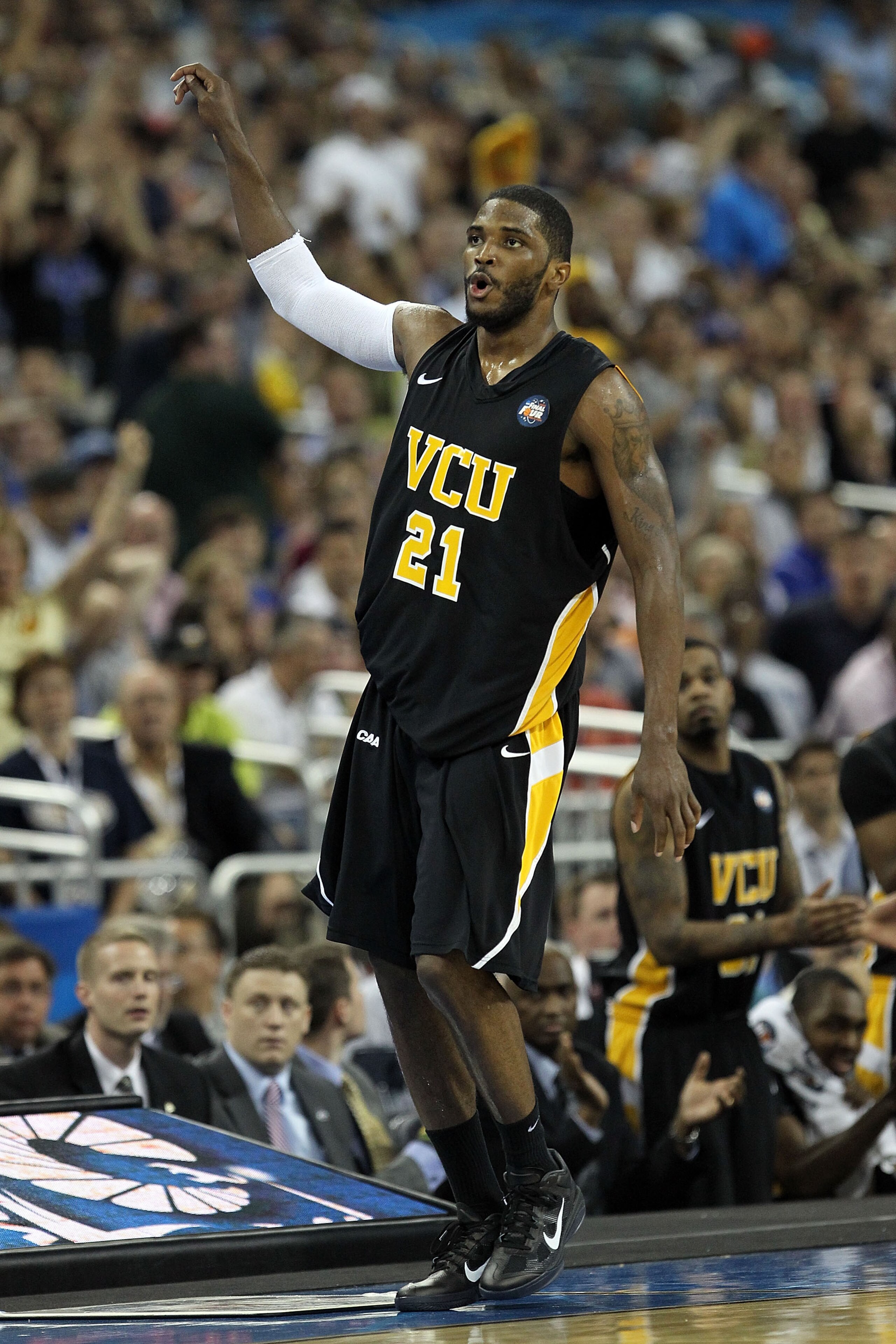 HOUSTON, TX - APRIL 02:  Jamie Skeen #21 of the Virginia Commonwealth Rams reacts after hitting a three pointer and drawing a foul against the Butler Bulldogs during the National Semifinal game of the 2011 NCAA Division I Men's Basketball Championship at