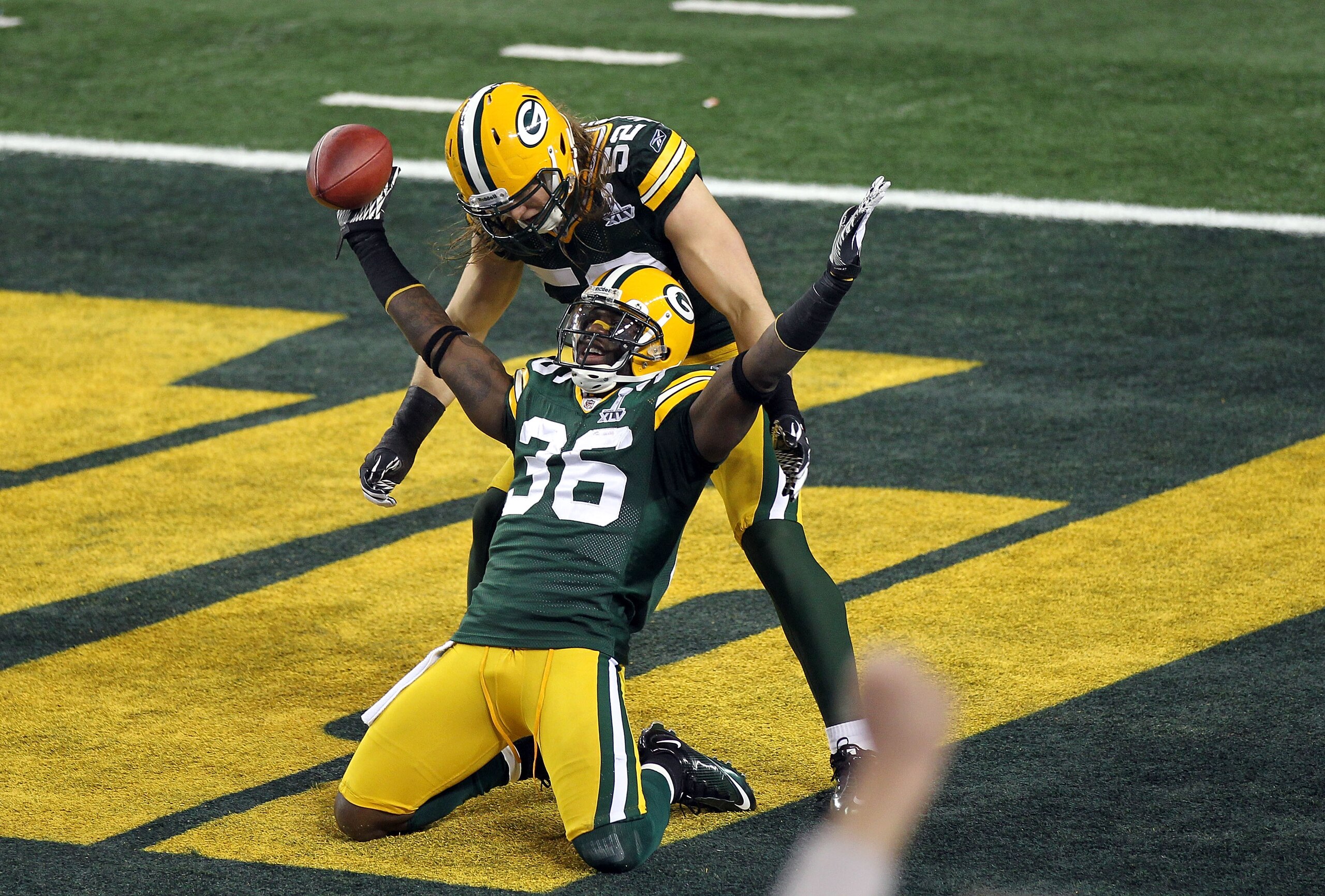 ARLINGTON, TX - FEBRUARY 06:  Nick Collins #36 of the Green Bay Packers celebrates with teammate Clay Matthews #52 after Collins returned an interception for a touchdown against the Pittsburgh Steelers during Super Bowl XLV at Cowboys Stadium on February