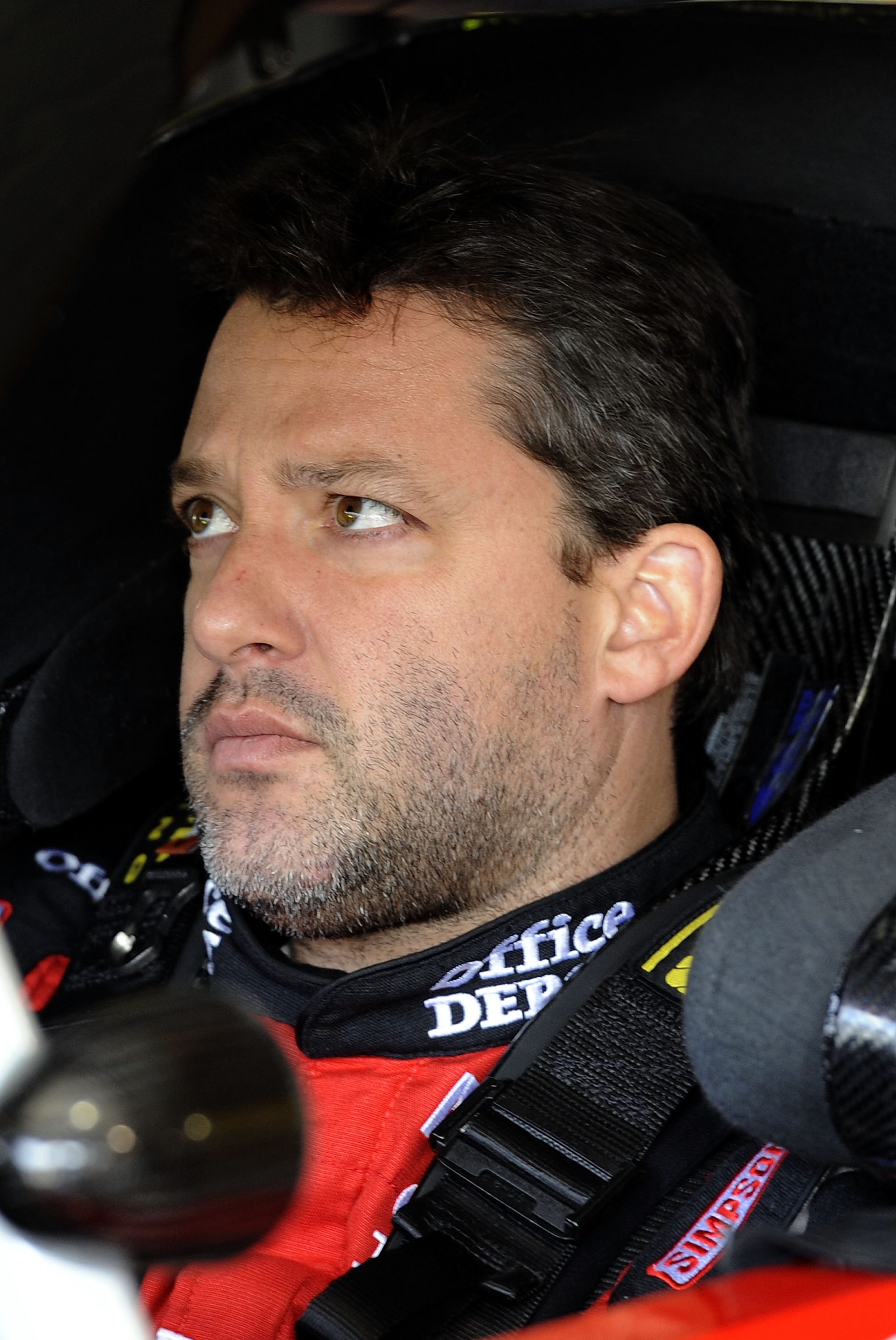 MARTINSVILLE, VA - APRIL 01:  Tony Stewart, driver of the #14 Office Depot/Mobil 1 Chevrolet, sits in his car during practice for the NASCAR Sprint Cup Series Goody's Fast Relief 500 at Martinsville Speedway on April 1, 2011 in Martinsville, Virginia.  (P