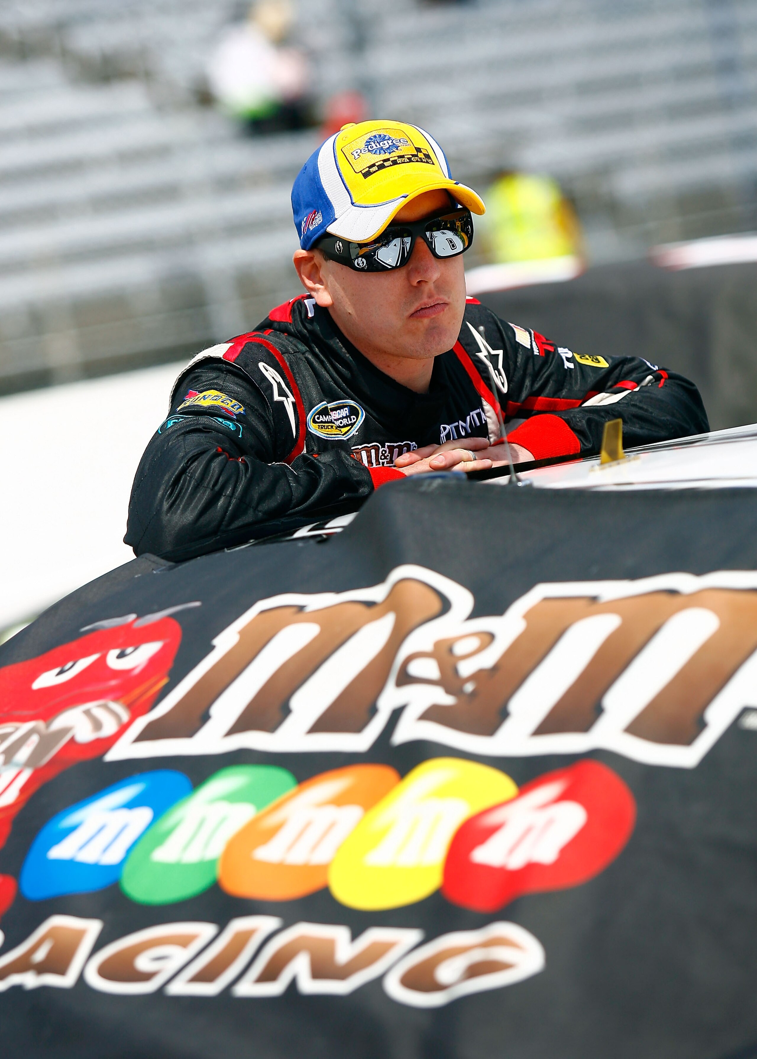 MARTINSVILLE, VA - APRIL 02:  Kyle Busch leans on the #18 M&M's Toyota during qualifying for the NASCAR Sprint Cup Series Goody's Fast Relief 500 at Martinsville Speedway on April 2, 2011 in Martinsville, Virginia.  (Photo by Jason Smith/Getty Images)