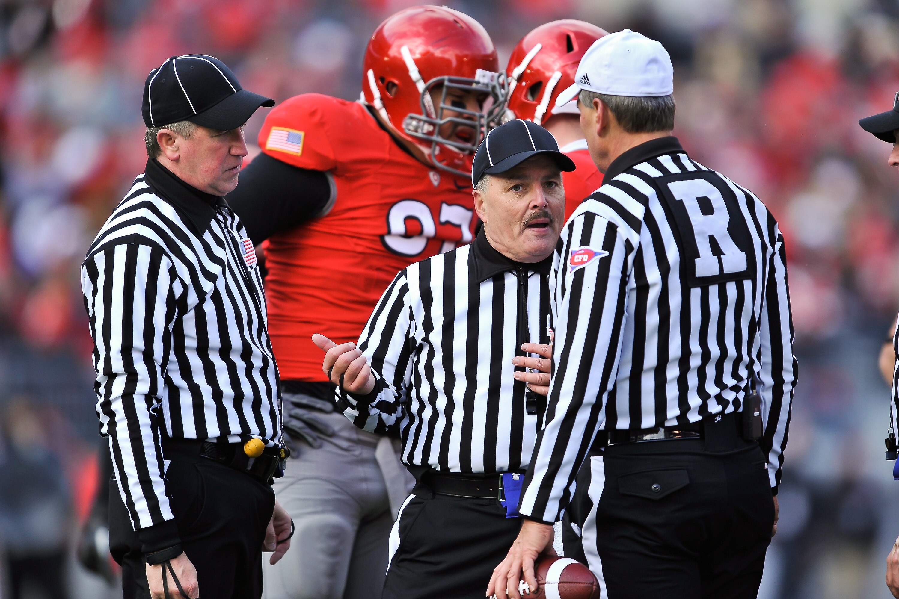 COLUMBUS, OH - NOVEMBER 27:  Referees discuss a call during a game between The Ohio State Buckeyes and the Michigan Wolverines at Ohio Stadium on November 27, 2010 in Columbus, Ohio.  (Photo by Jamie Sabau/Getty Images)