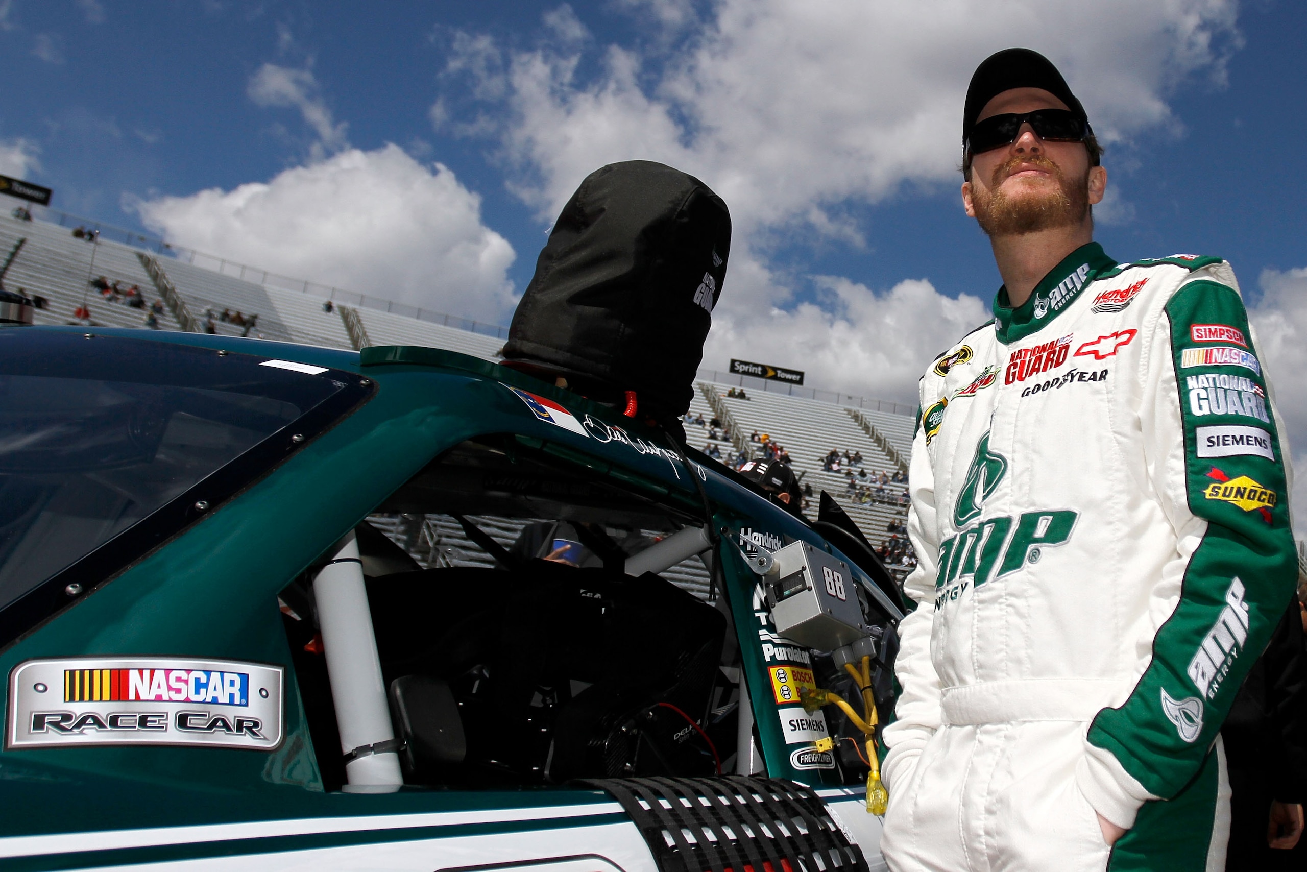 MARTINSVILLE, VA - APRIL 02:  Dale Earnhardt Jr., driver of the #88 Amp Energy/National Guard Chevrolet, stands on the grid during qualifying for the NASCAR Sprint Cup Series Goody's Fast Relief 500 at Martinsville Speedway on April 2, 2011 in Martinsvill