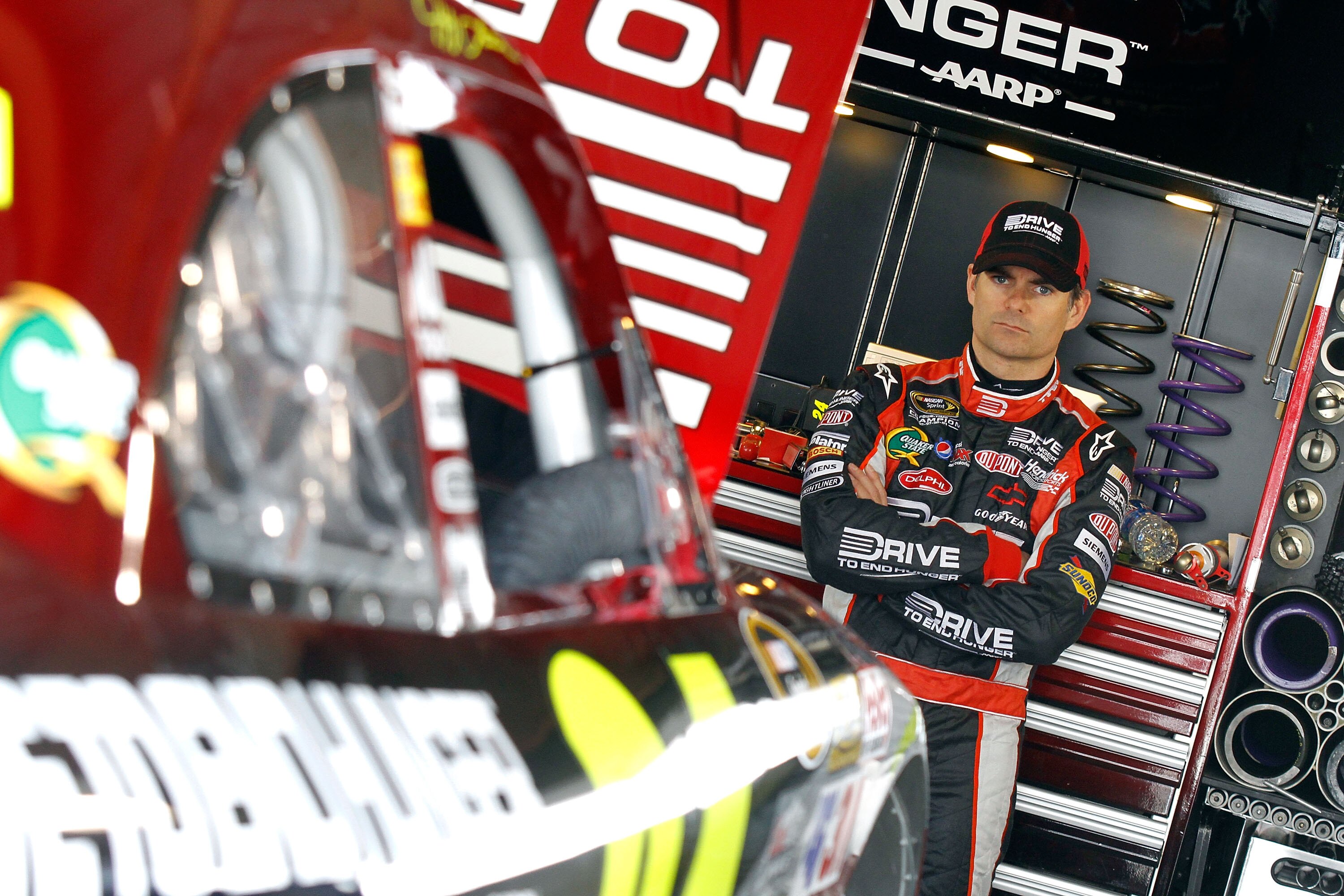 MARTINSVILLE, VA - APRIL 01:  Jeff Gordon, driver of the #24 Drive to End Hunger/AARP Chevrolet, stands in the garage during practice for the NASCAR Sprint Cup Series Goody's Fast Relief 500 at Martinsville Speedway on April 1, 2011 in Martinsville, Virgi