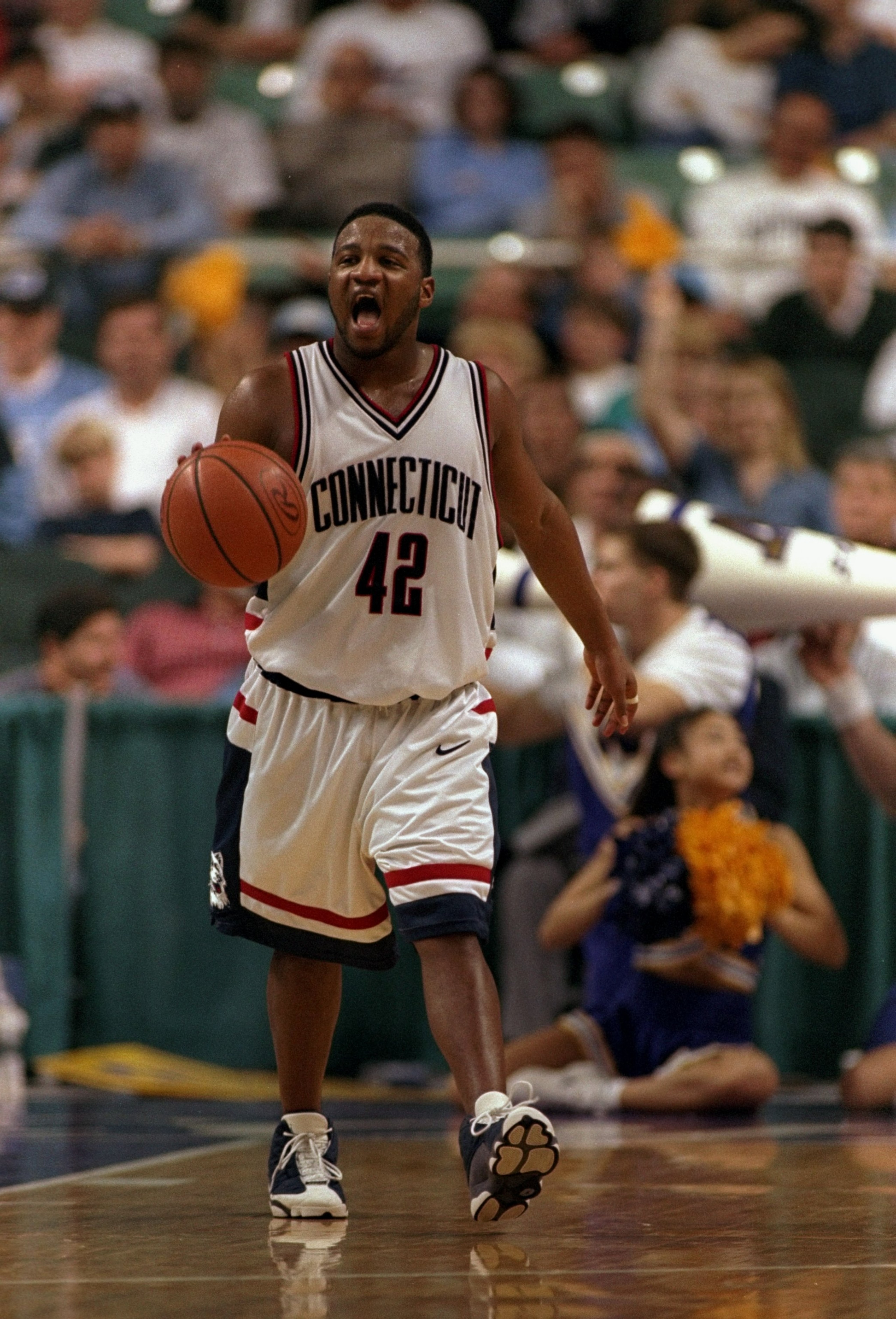 19 Mar 1998:  Guard Khalid El''Amin of the Connecticut Huskies in action during an NCAA Tournament game against the Washington Huskies at the Greensboro Coliseum in Greensboro, North Carolina.  Connecticut defeated Washington 75-74. Mandatory Credit: Crai