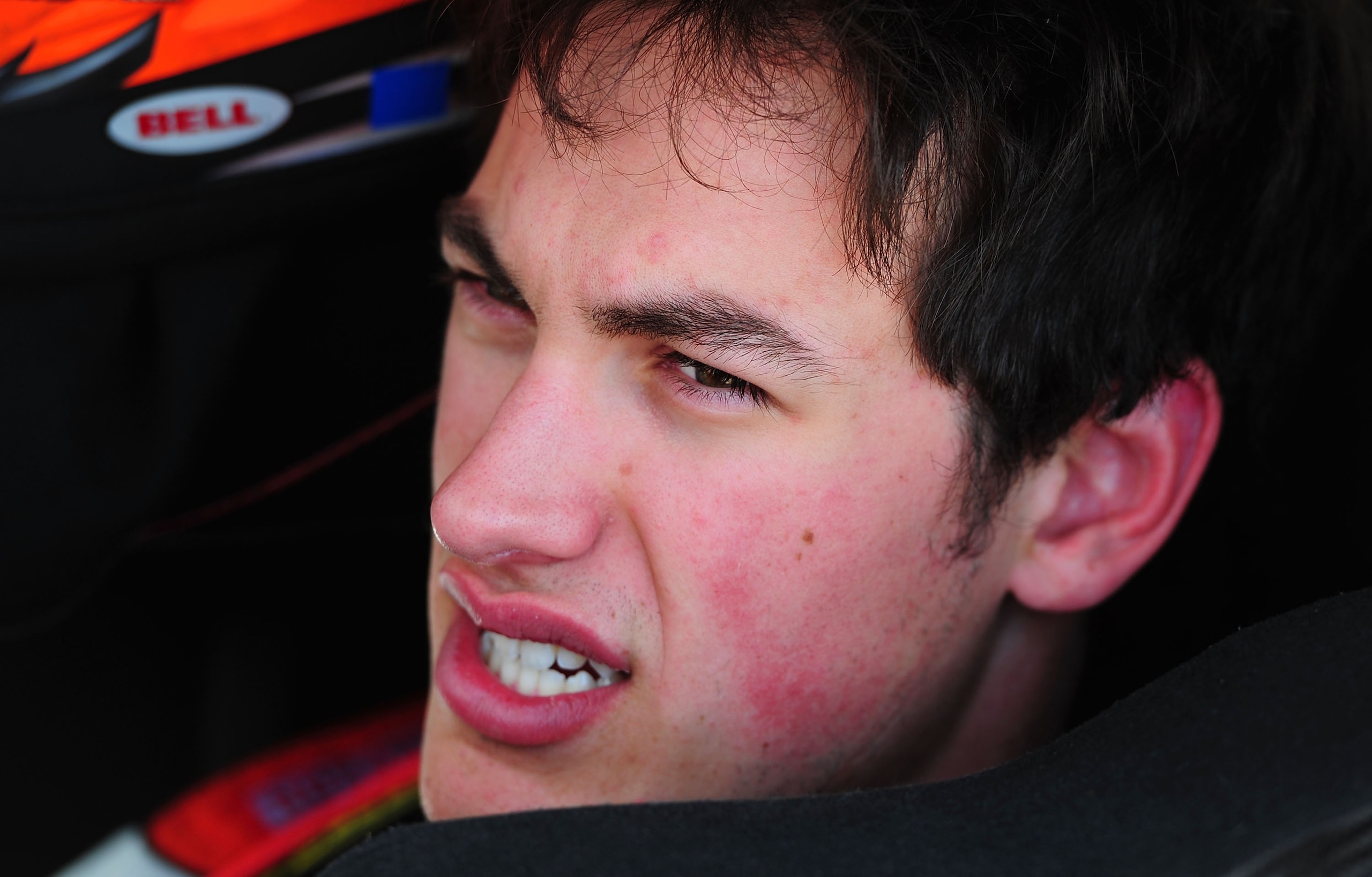 FONTANA, CA - MARCH 25:  Joey Logano, driver of the #20 The Home Depot Toyota, sits in his car during practice for the NASCAR Sprint Cup Series Auto Club 400 at Auto Club Speedway on March 25, 2011 in Fontana, California.  (Photo by Robert Laberge/Getty I