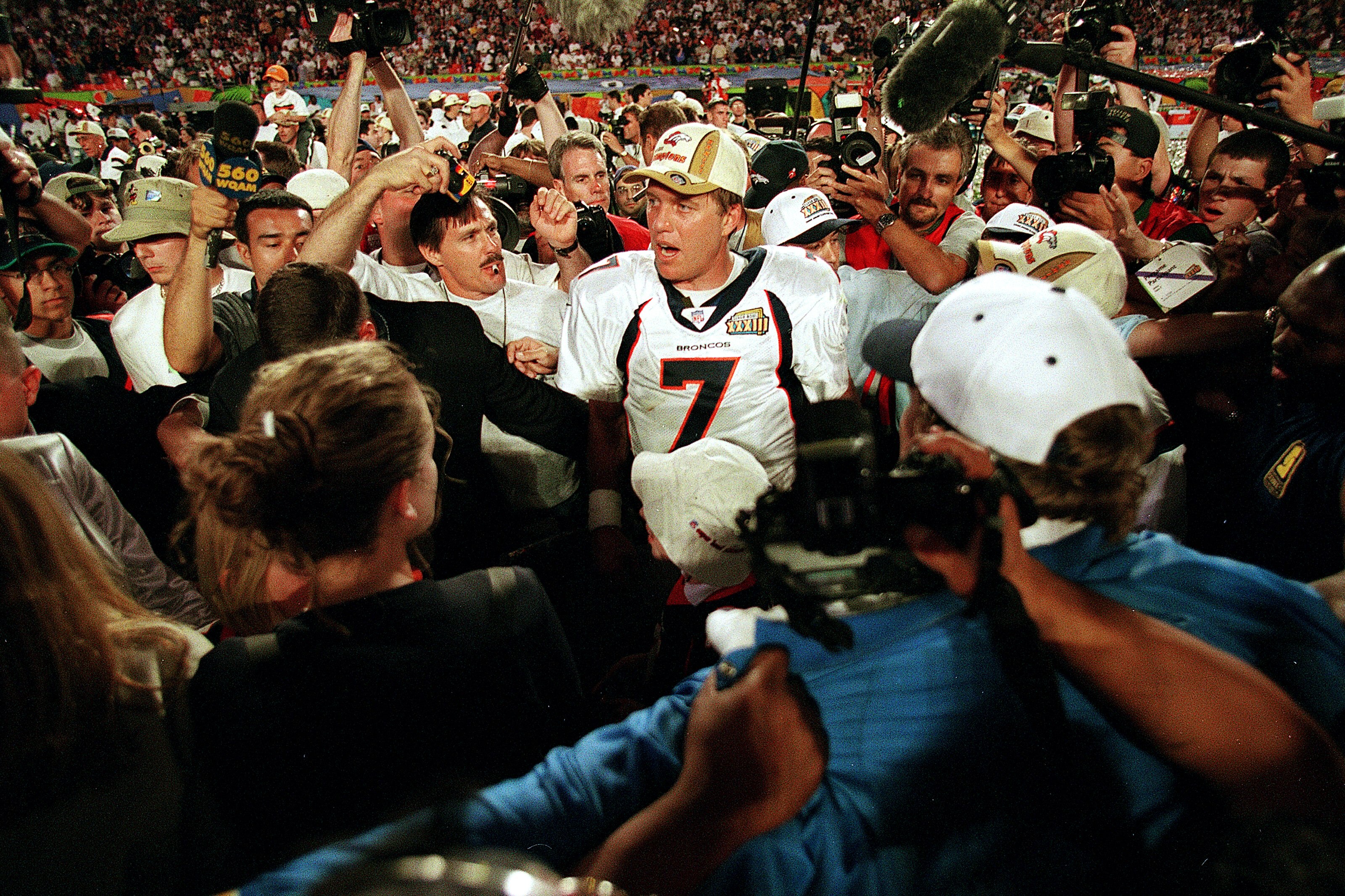 31 Jan 1999:   John Elway #7 of the Denver Broncos talks to reporters after the Superbowl XXXIII against the Atlanta Falcons at the Pro Player Stadium in Miami, Florida. The Broncos defeated the Falcons 34-19. Mandatory Credit: Rick Stewart  /Allsport