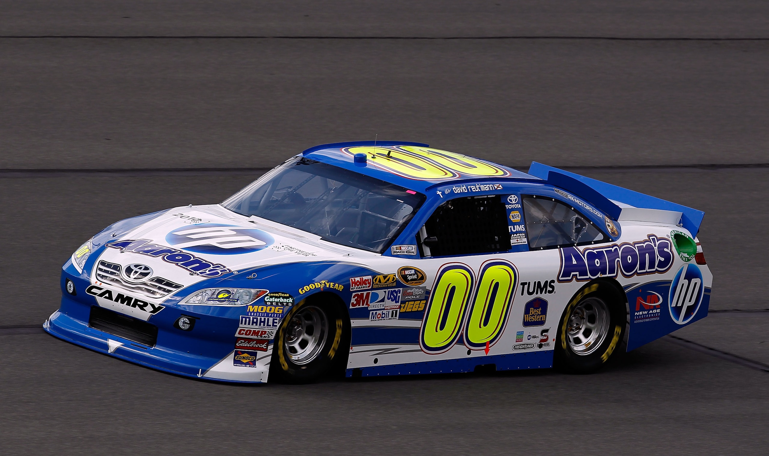 FONTANA, CA - MARCH 25:  David Reutimann, driver of the #00 Aaron's Toyota, practices for the NASCAR Sprint Cup Series Auto Club 400 at Auto Club Speedway on March 25, 2011 in Fontana, California.  (Photo by Tom Pennington/Getty Images)