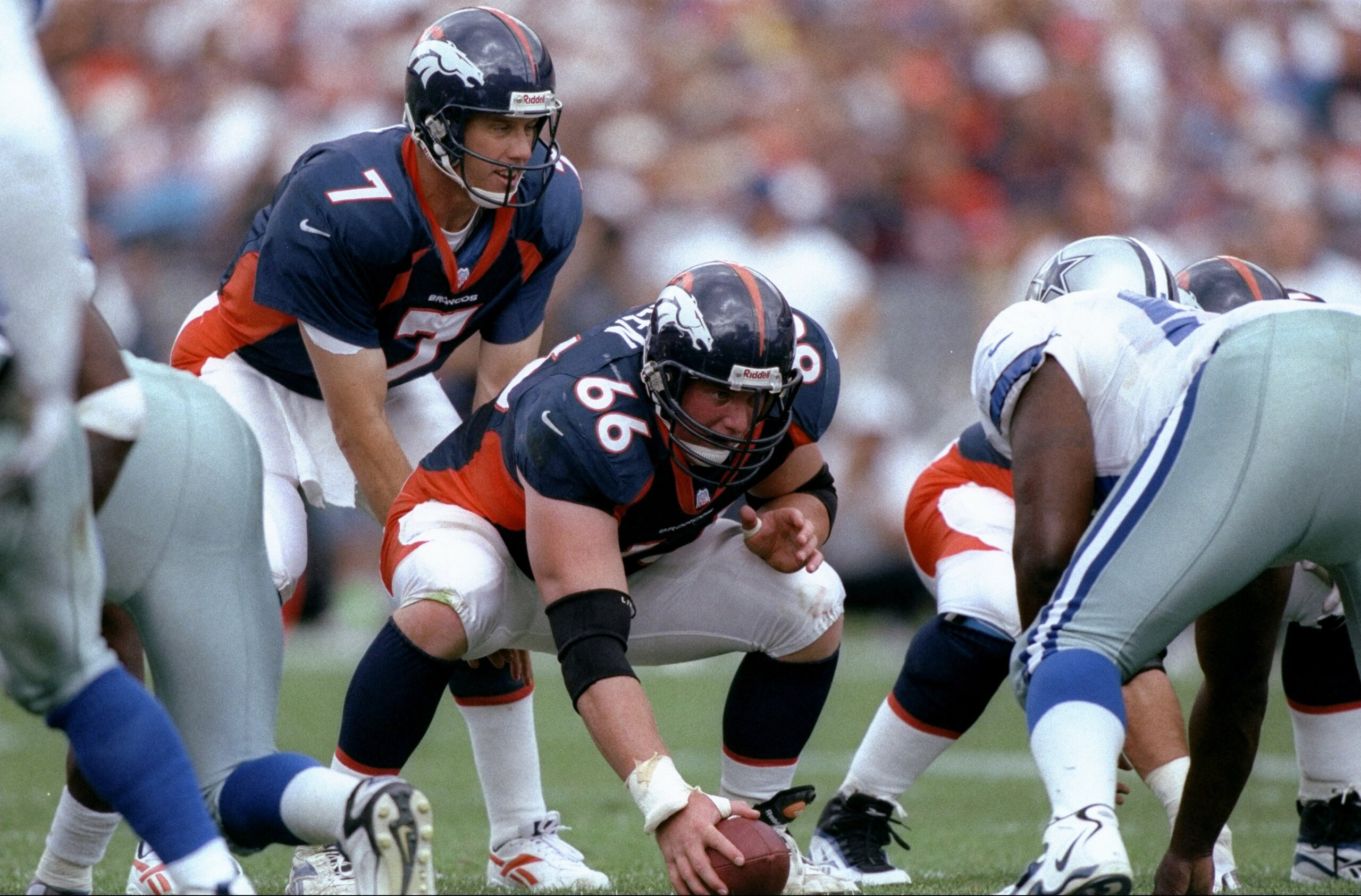 13 Sep 1998: Quarterback John Elway #7 and center Tom Nalen #66 of the Denver Broncos in action during the game against the Dallas Cowboys at the Mile High Stadium in Denver, Colorado. The Broncos defeated the Cowboys 42-23. Mandatory Credit: Brian Bahr 13 Sep 1998: Quarterback John Elway #7 and center Tom Nalen #66 of the Denver Broncos in action during the game against the Dallas Cowboys at the Mile High Stadium in Denver, Colorado. The Broncos defeated the Cowboys 42-23. Mandatory Credit: Brian Bahr