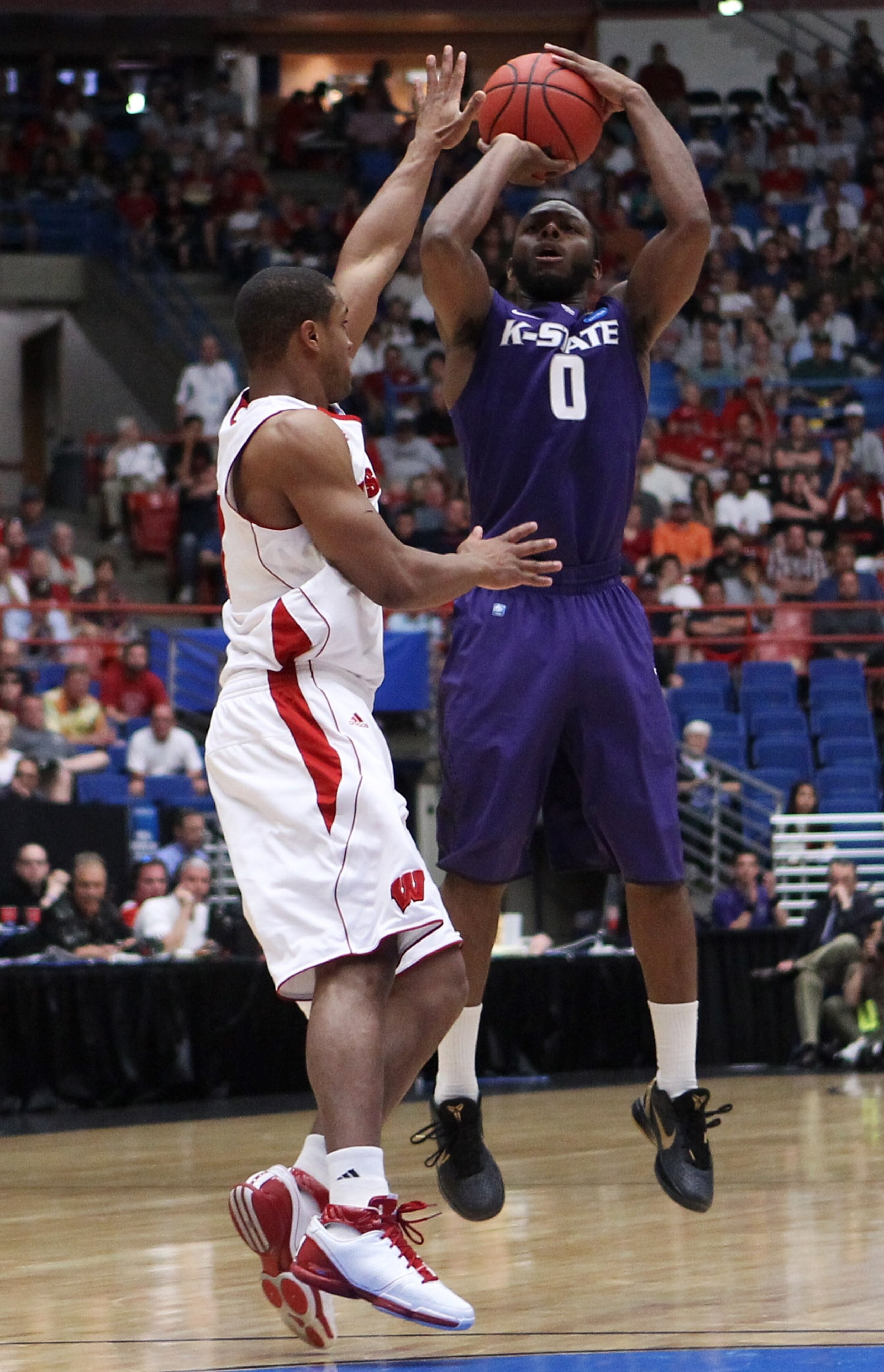 TUCSON, AZ - MARCH 19: Jacob Pullen #0 of the Kansas State Wildcats shoots against the Wisconsin Badgers during the third round of the 2011 NCAA men's basketball tournament at McKale Center on March 19, 2011 in Tucson, Arizona. (Photo by Christian Peter TUCSON, AZ - MARCH 19: Jacob Pullen #0 of the Kansas State Wildcats shoots against the Wisconsin Badgers during the third round of the 2011 NCAA men's basketball tournament at McKale Center on March 19, 2011 in Tucson, Arizona. (Photo by Christian Peter