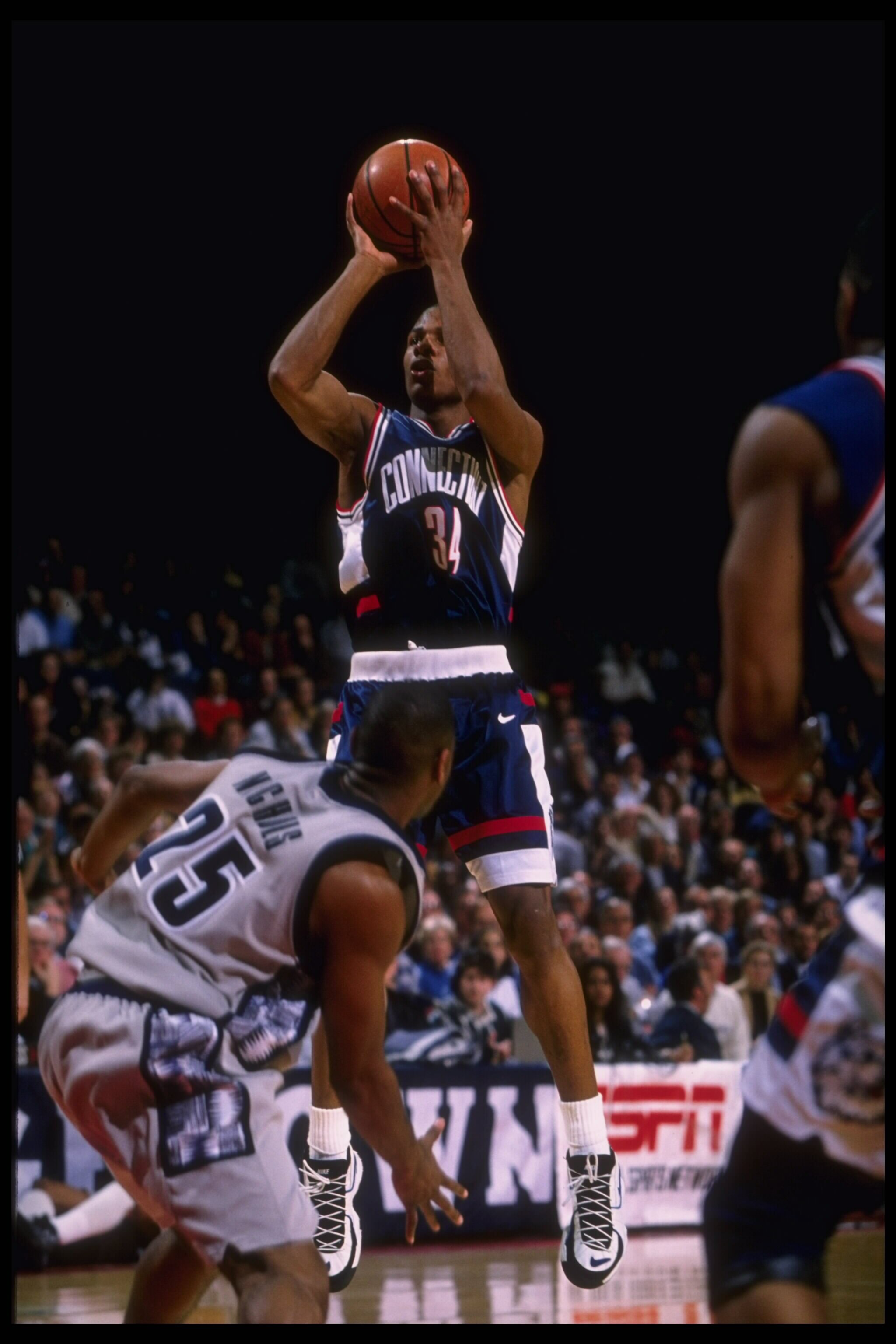 19 Feb 1996: Guard Ray Allen of the Connecticut Huskies takes a jump shot in front of the defense of the Georgetown Hoyas in this Big East match-up at the USAir Arena in Washington, D.C. Georgetown defeated UConn 77-65.