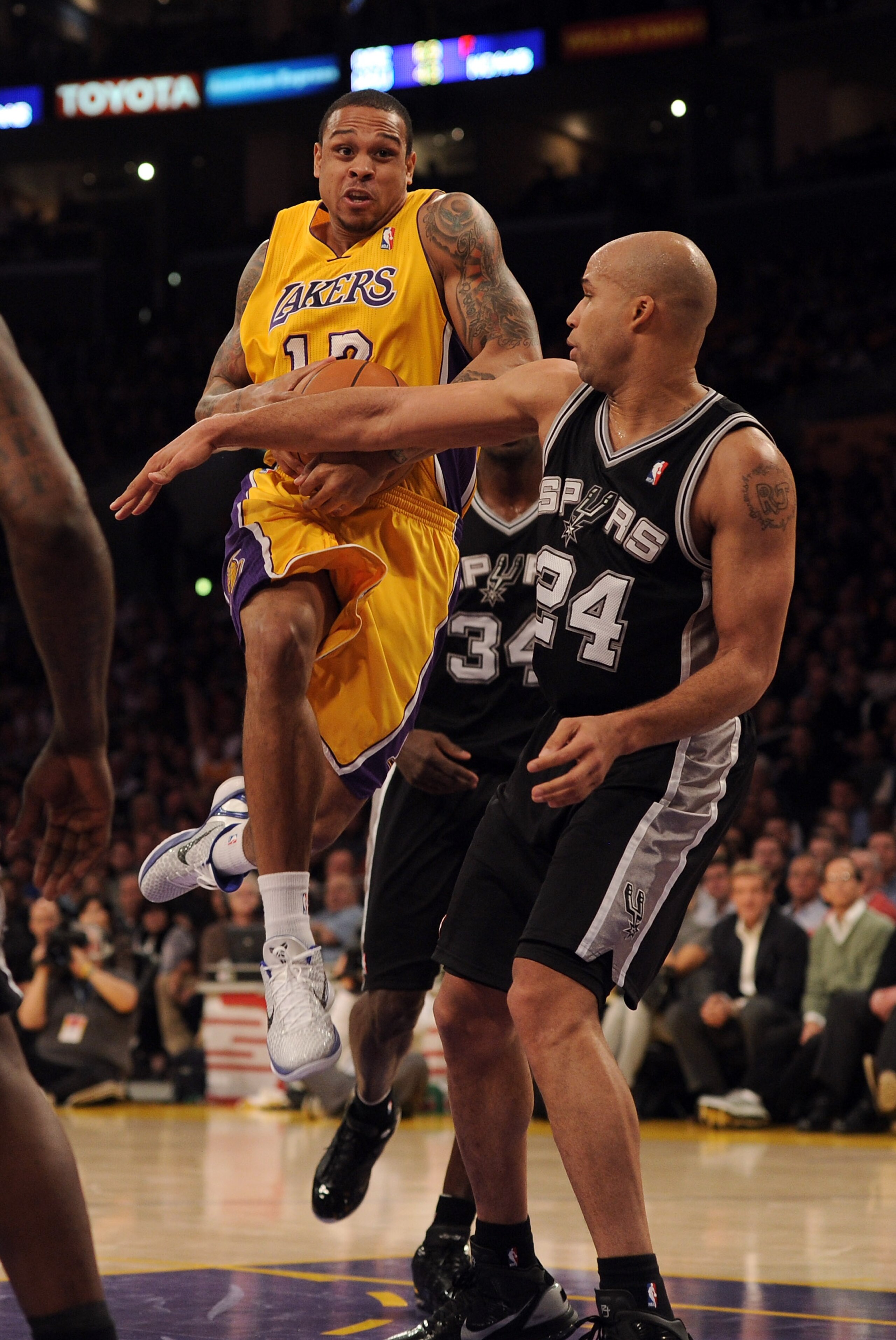 LOS ANGELES, CA - FEBRUARY 03: Shannon Brown #12 of the Los Angeles Lakers tries to get a shot off in front of Richard Jeffferson #24 of the San Antonio Spurs at Staples Center on February 3, 2011 in Los Angeles, California. NOTE TO USER: User expressly LOS ANGELES, CA - FEBRUARY 03: Shannon Brown #12 of the Los Angeles Lakers tries to get a shot off in front of Richard Jeffferson #24 of the San Antonio Spurs at Staples Center on February 3, 2011 in Los Angeles, California. NOTE TO USER: User expressly