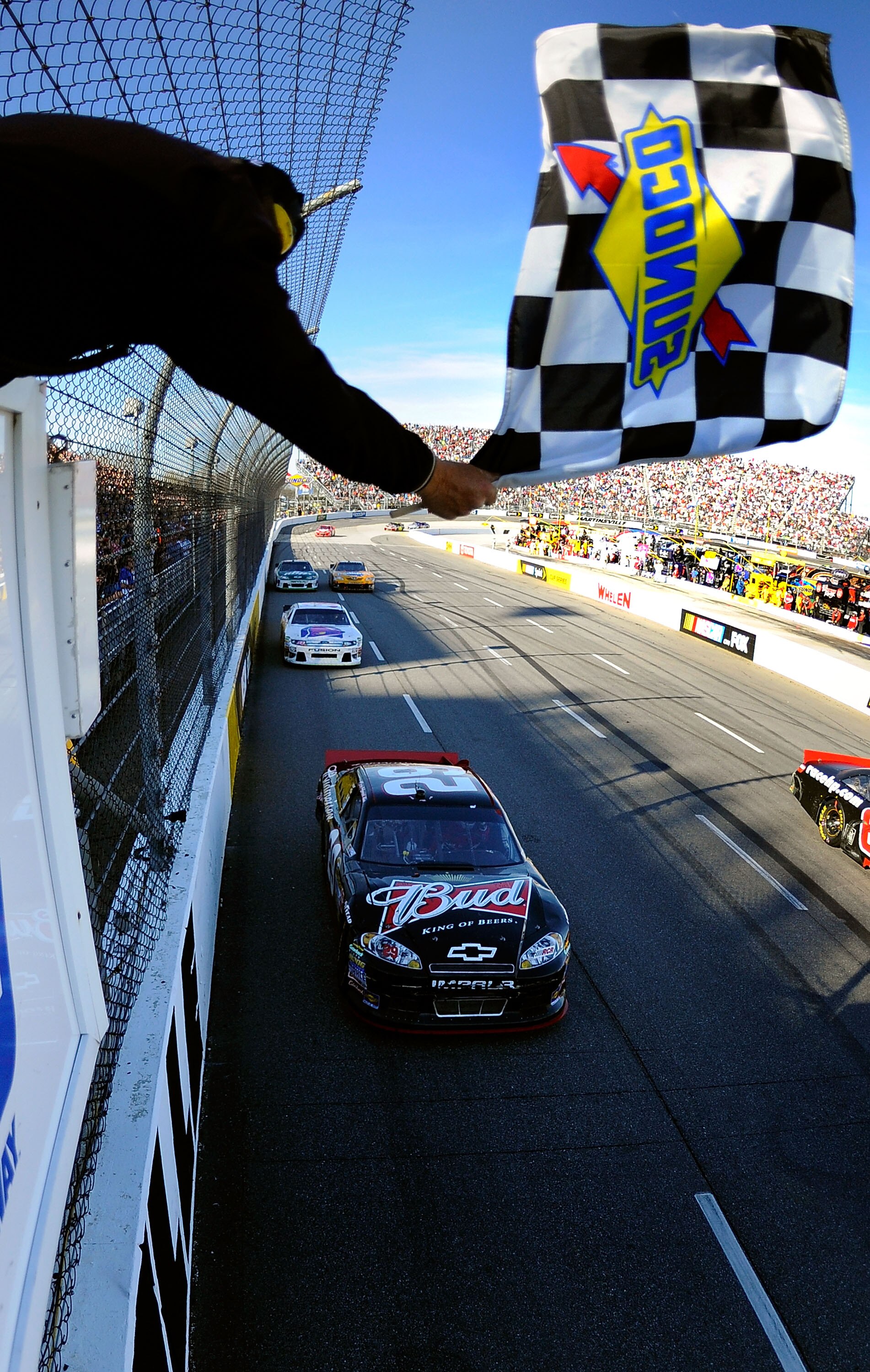 MARTINSVILLE, VA - APRIL 03:  Kevin Harvick, driver of the #29 Budweiser Chevrolet, crosses the finish line to win the NASCAR Sprint Cup Series Goody's Fast Relief 500 at Martinsville Speedway on April 3, 2011 in Martinsville, Virginia.  (Photo by Jared C