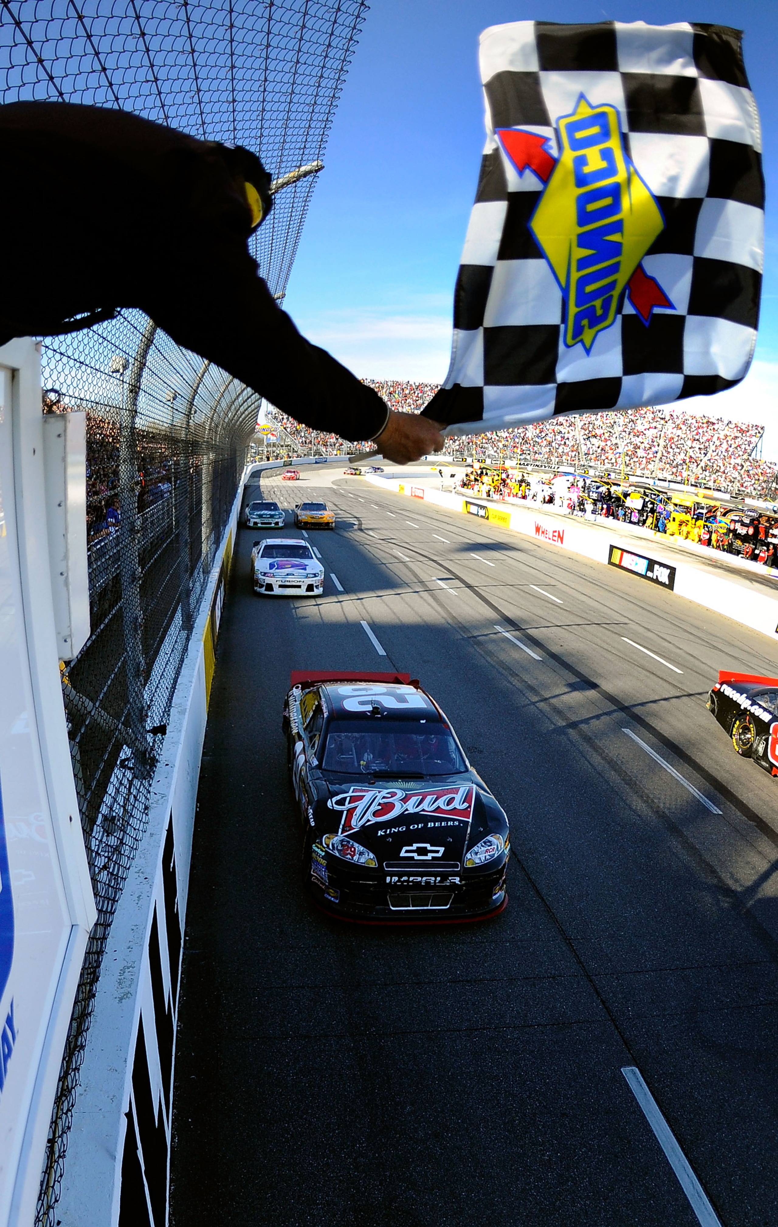 MARTINSVILLE, VA - APRIL 03:  Kevin Harvick, driver of the #29 Budweiser Chevrolet, crosses the finish line to win the NASCAR Sprint Cup Series Goody's Fast Relief 500 at Martinsville Speedway on April 3, 2011 in Martinsville, Virginia.  (Photo by Jared C