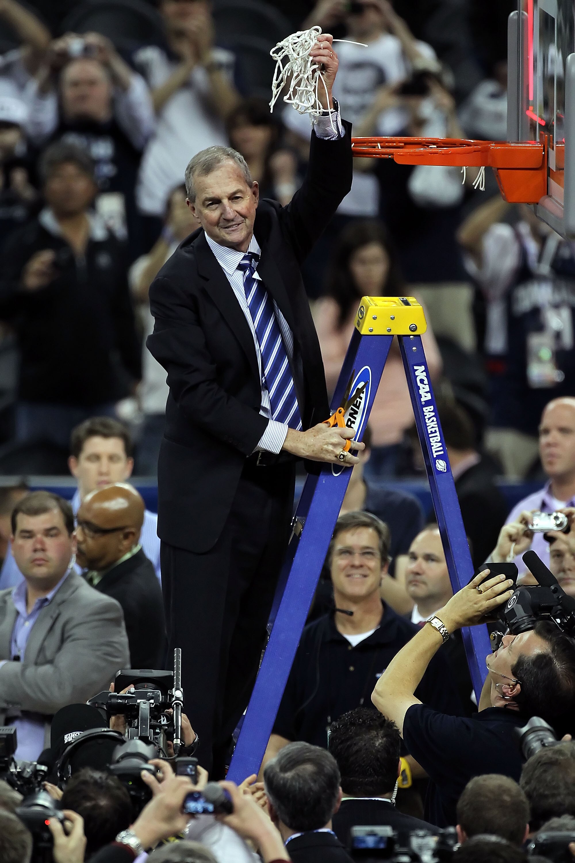 HOUSTON, TX - APRIL 04:  Head coach Jim Calhoun of the Connecticut Huskies cuts down the net after defeating the Butler Bulldogs to win the National Championship Game of the 2011 NCAA Division I Men's Basketball Tournament by a score of 53-41 at Reliant S