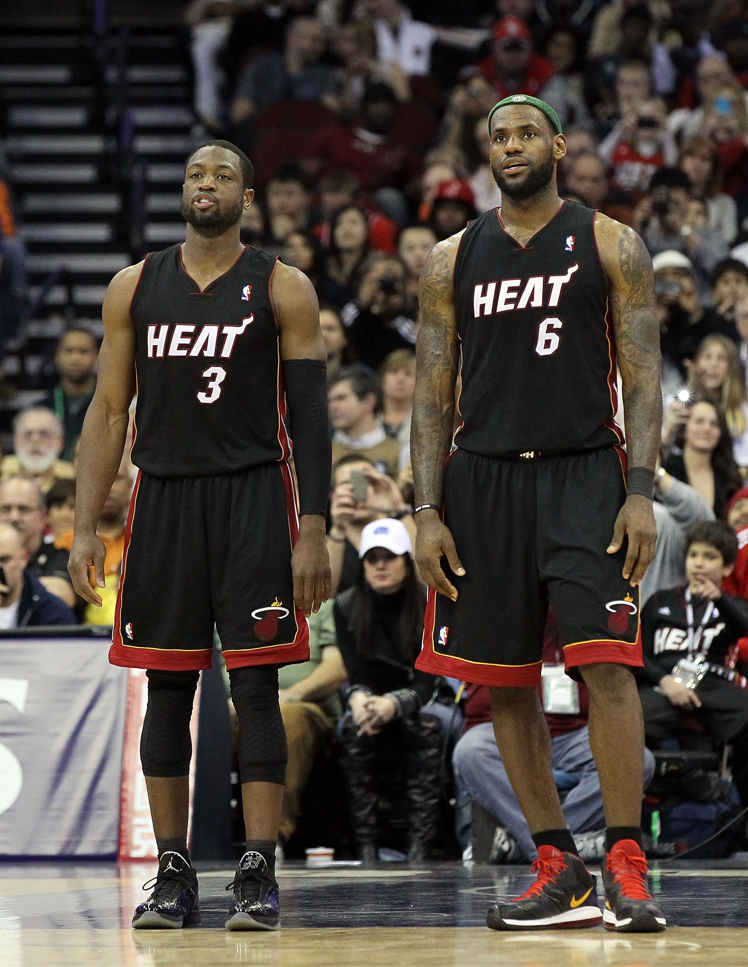 NEWARK, NJ - APRIL 03: LeBron James #6 and Dwyane Wade #3 of the Miami Heat look on against the New Jersey Nets at the Prudential Center on April 3, 2011 in Newark, New Jersey.The Heat defeated the Nets 108-94.NOTE TO USER: User expressly acknowledges an NEWARK, NJ - APRIL 03: LeBron James #6 and Dwyane Wade #3 of the Miami Heat look on against the New Jersey Nets at the Prudential Center on April 3, 2011 in Newark, New Jersey.The Heat defeated the Nets 108-94.NOTE TO USER: User expressly acknowledges an