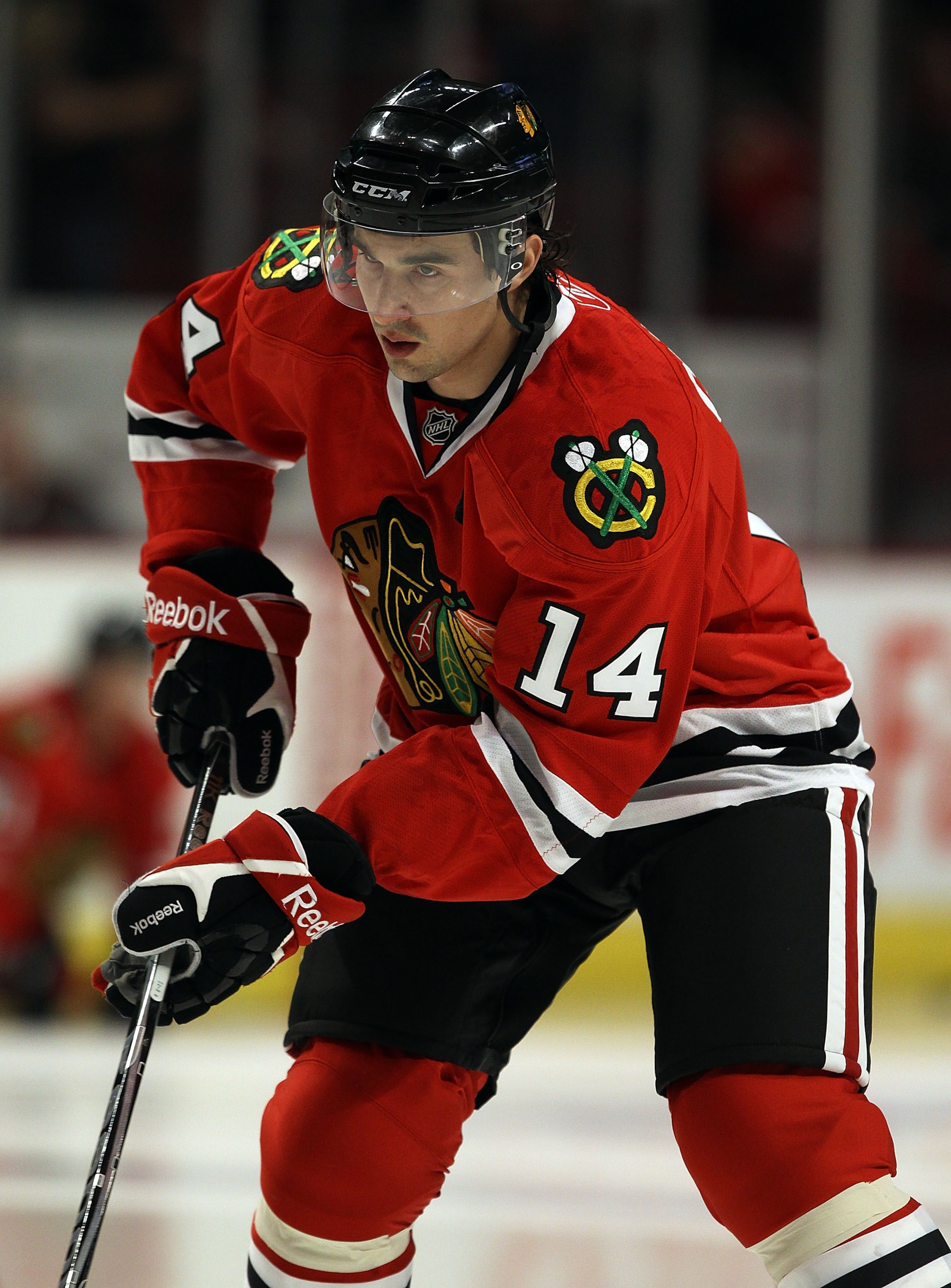 CHICAGO, IL - MARCH 02: Chris Campoli #14 of the Chicago Blackhawks participates in warm-ups for the first time after being traded to the Blackhaawks from the Ottawa Senators before a game against the Calgary Flames at the United Center on March 2, 2011 i