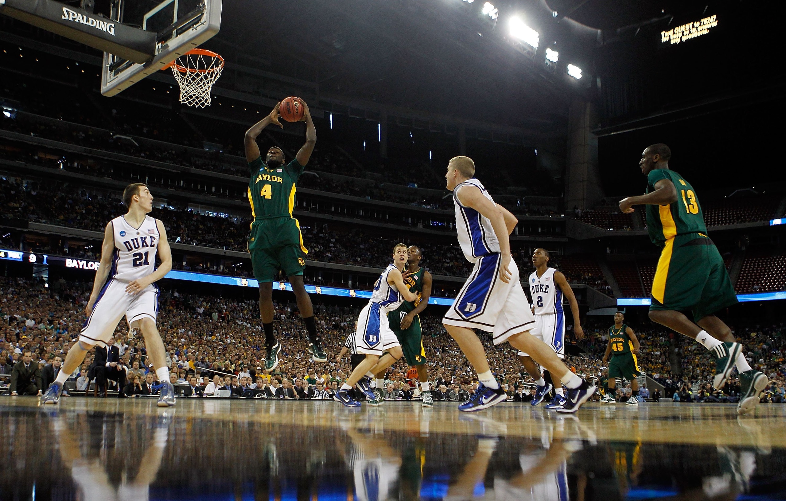 HOUSTON - MARCH 28: Quincy Acy #4 of the Baylor Bears grabs a rebound against the Duke Blue Devils during the south regional final of the 2010 NCAA men's basketball tournament at Reliant Stadium on March 28, 2010 in Houston, Texas. Duke defeated Baylor 78
