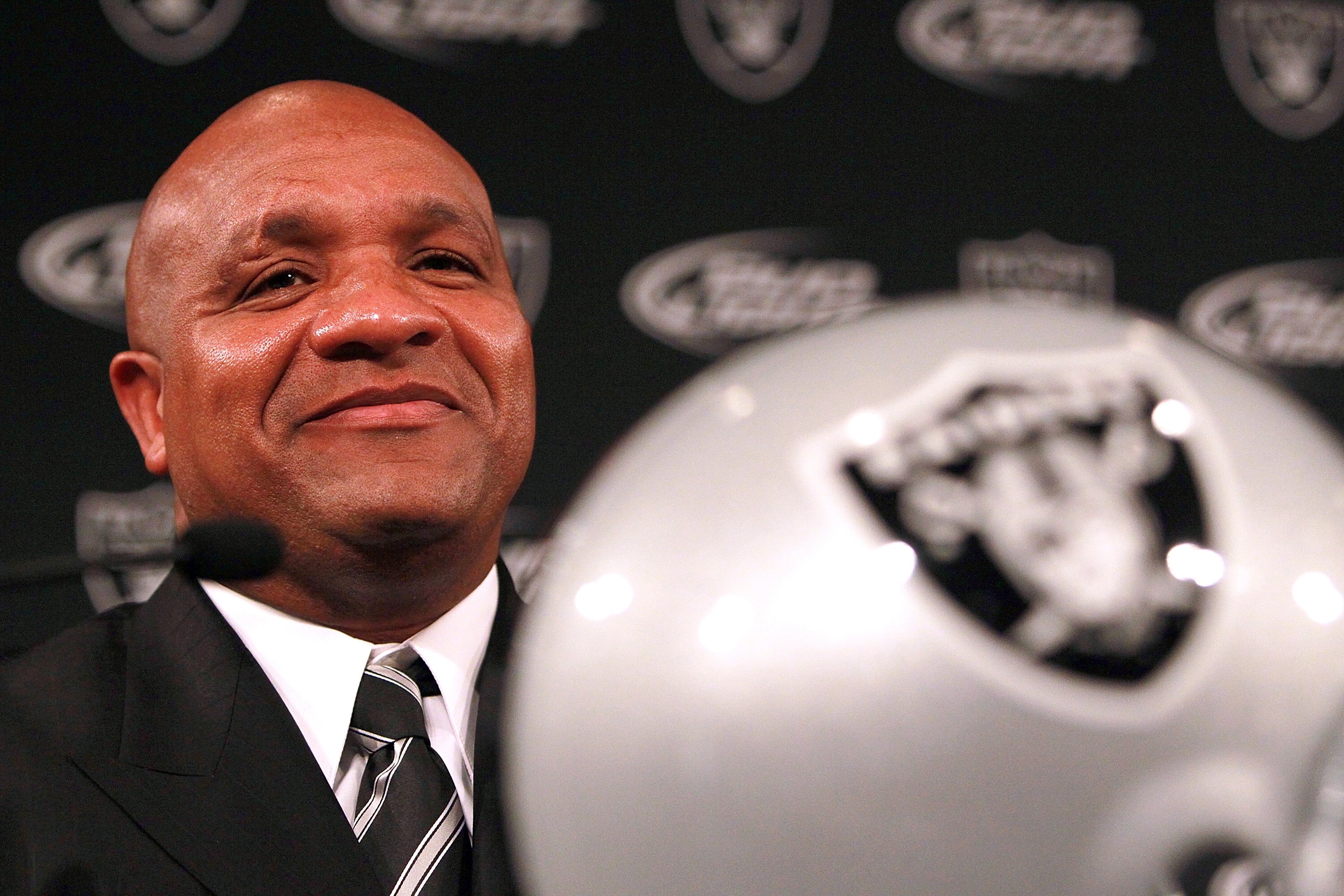 ALAMEDA, CA - JANUARY 18:  Hue Jackson looks on after he was introduced as the new head coach of the Oakland Raiders on January 18, 2011 in Alameda, California.  Hue Jackson was introduced as the new coach of the Oakland Raiders, replacing the fired Tom C