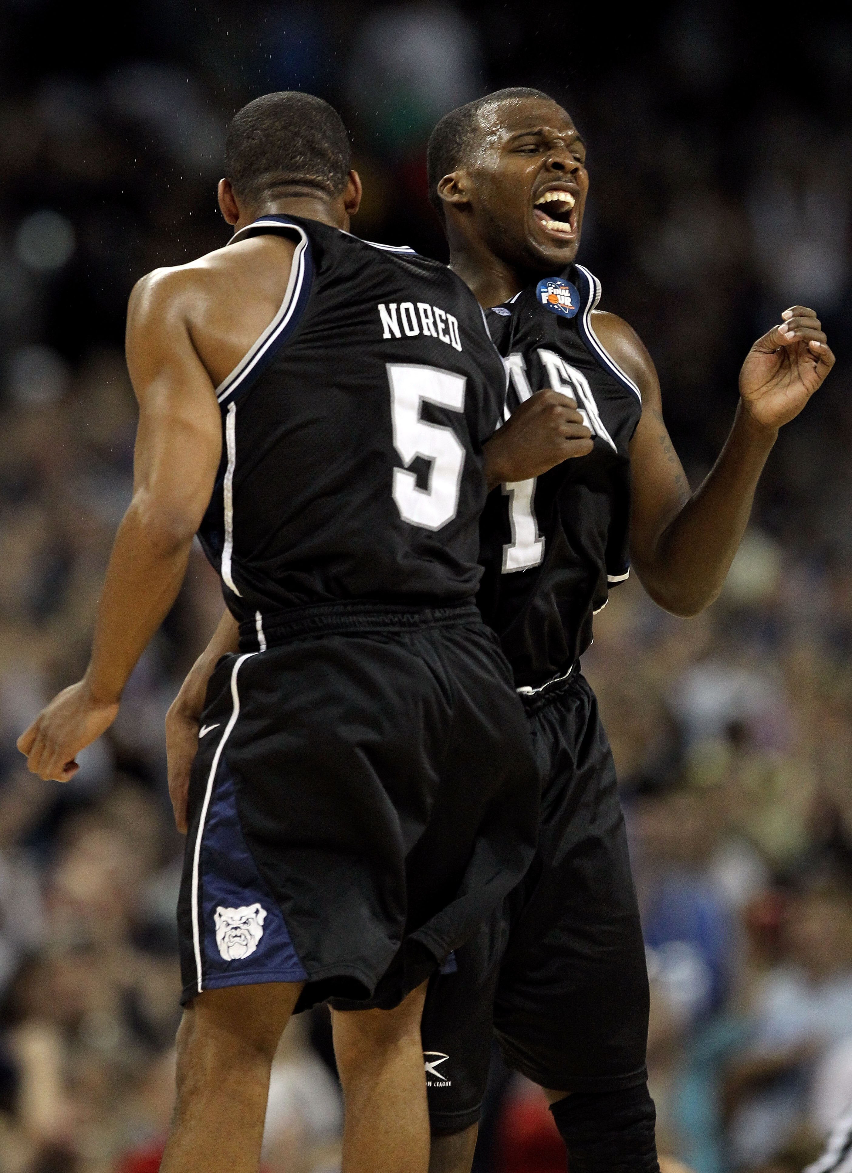 HOUSTON, TX - APRIL 04:  Shelvin Mack #1 and Ronald Nored #5 of the Butler Bulldogs celebrate after a shot to end the first half against the Connecticut Huskies during the National Championship Game of the 2011 NCAA Division I Men's Basketball Tournament