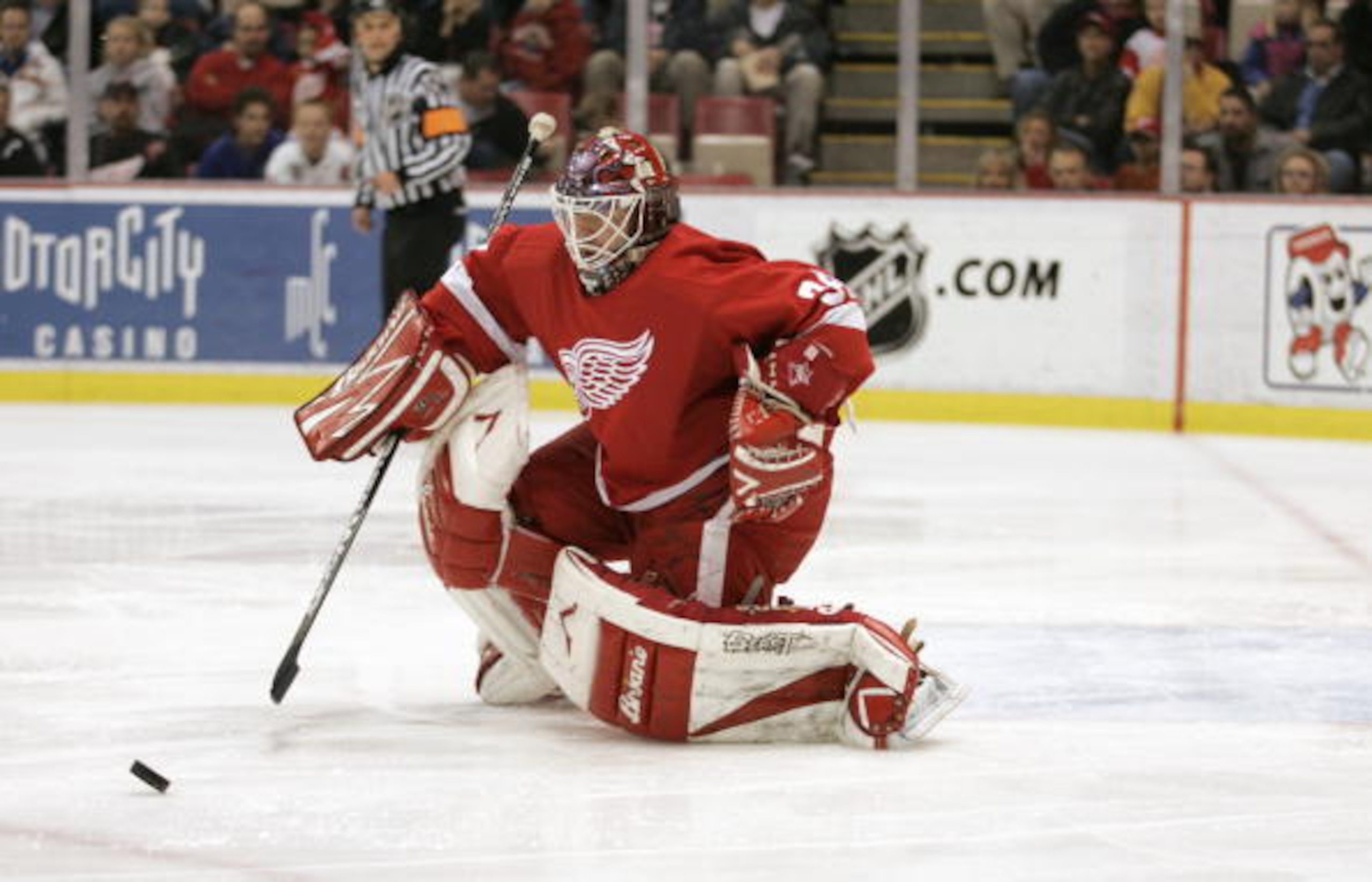 DETROIT - NOVEMBER 11:  Goaltender Manny Legace #34 of the Detroit Red Wings goes down to make a save on the Minnesota Wild during the NHL game on November 11, 2005 at Joe Louis Arena in Detroit, Michigan.  The Red Wings defeated the Wild 3-1.  (Photo By